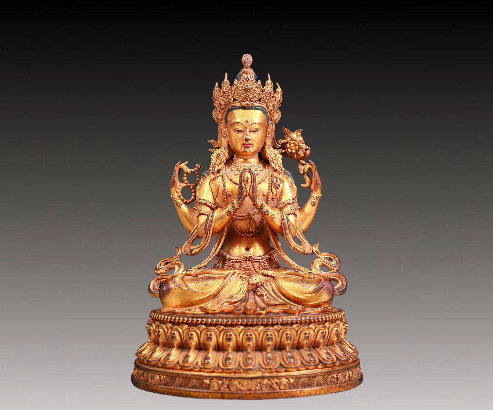 A solemn gilt bronze four-armed Guanyin statue (1 of 11)