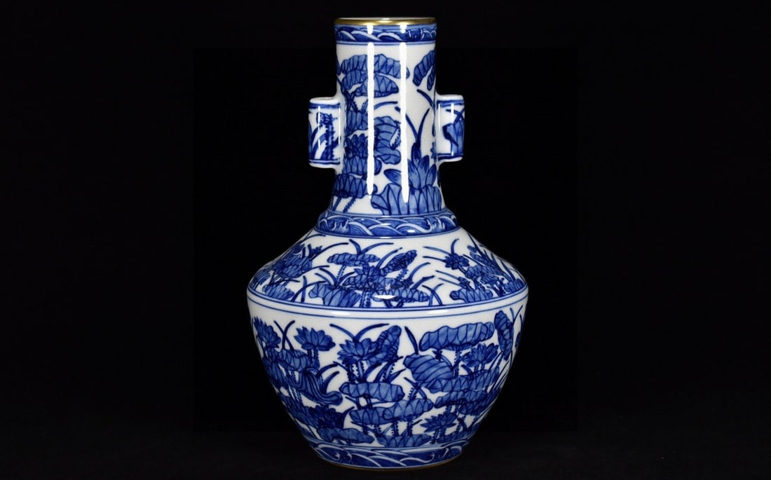 An Exquisite Blue and White Lotus Pattern Double-Ears Vase: An Exquisite Blue and White Lotus Pattern Double-Ears Vase,Qing Dynasty,China,with Qianlong Six-character Mark,Size:8.7inx6.3in,青花荷花纹双耳瓶,中