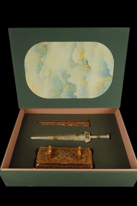 An Exquisite Filigree and Gilding Inlaid White Jade Sword Ornament,Inlaid Gems: An Exquisite Filigree and Gilding Inlaid White Jade Sword Ornament,Inlaid Gems,Qing Dynasty,China,with Qianlong Four-character Mark,Size:16.1inx3.9inx6.3in,Weight:1345g,花丝鎏金