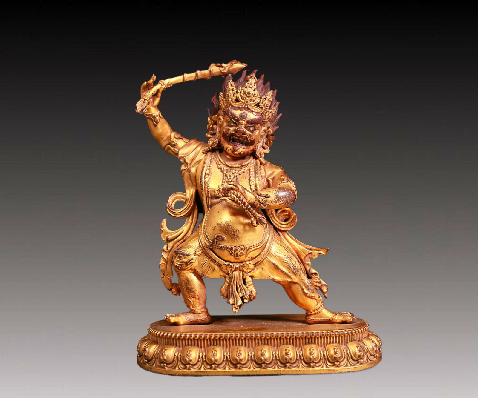 A solemn gilt bronze Vajra statue: A solemn gilt-bronze Vajra statue,Kangxi seven-character mark,Qing Dynasty,China. Vajra's figure is A solemn and majestic,symbolizing strong will and invincible power. At the same time,his face is A