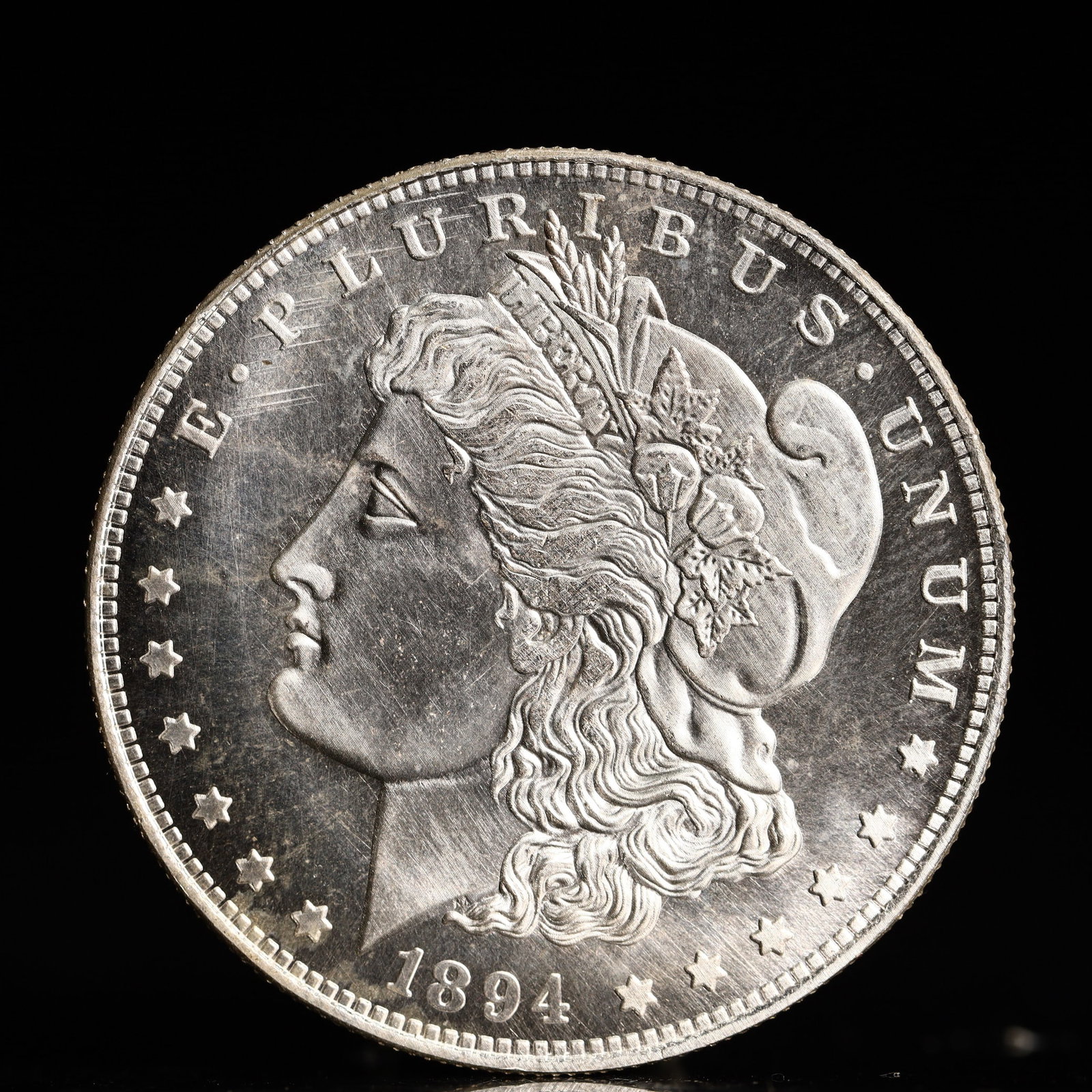 USA Morgan Dollar 1894 Coin: Obv: profile bust with date below and E PLURIBUS UNUM legend and stars around. Rev: eagle with In God we trust above within wreath with UNITED STATES OF AMERICA ONE DOLLAR legend. IN GOD WE TRUST / LI