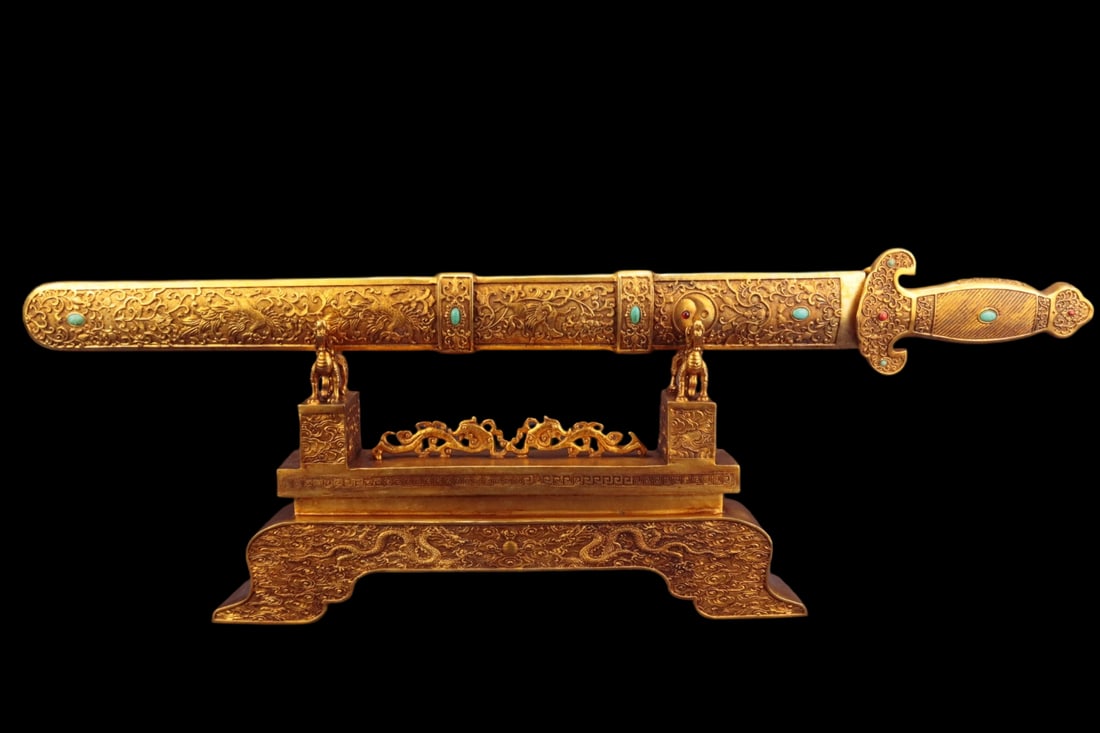 An Exquisite Gilt Bronze Flower and Bird Pattern Sword Ornament: An Exquisite Gilt Bronze Flower and Bird Pattern Sword Ornament,Qing Dynasty,China,Size:28.3inx2.4inx9.4in,Weight:5000g,铜鎏金花鸟纹宝剑摆件
