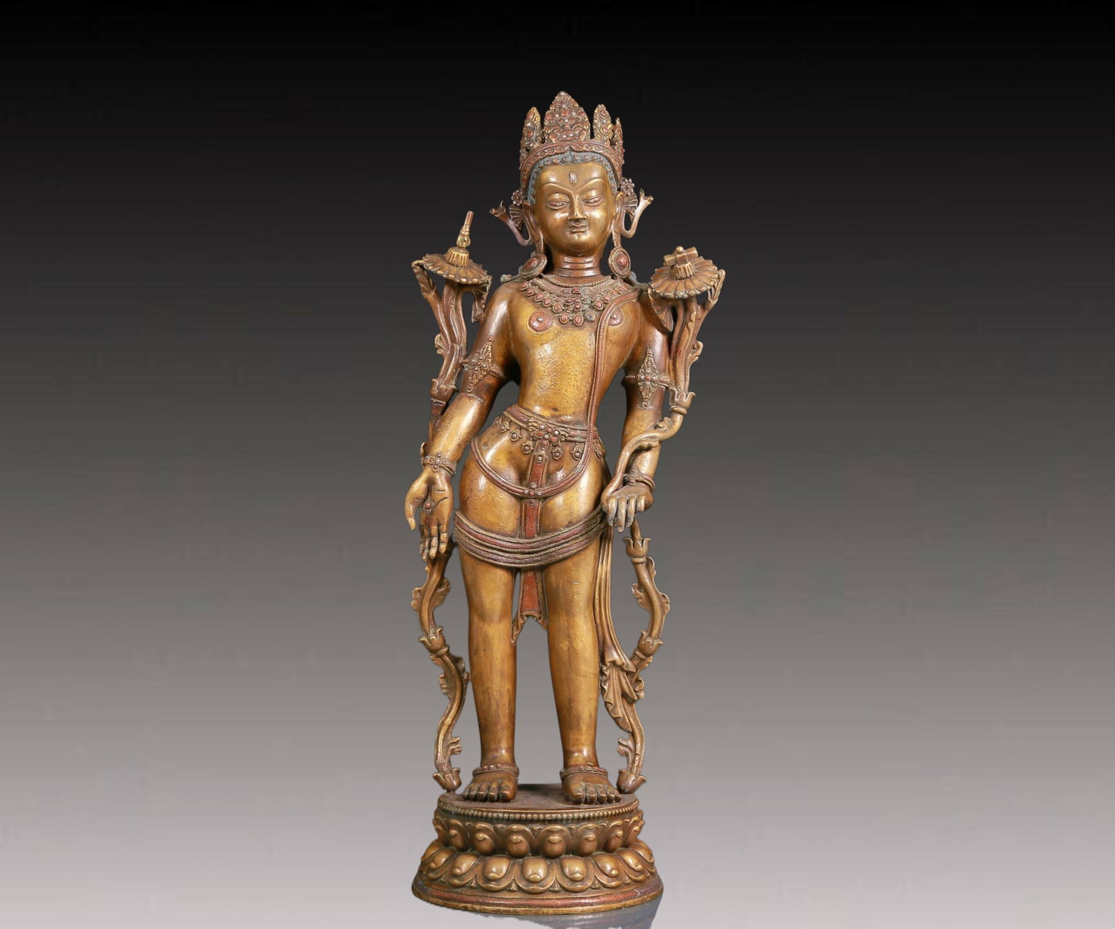 A solemn standing statue of alloy bronze Tara: A solemn standing statue of alloy bronze Tara,,Ming Dynasty,China. Tara has an elegant posture with a peaceful and compassionate expression. Her face is soft and A solemn,and her eyes are warm,as if