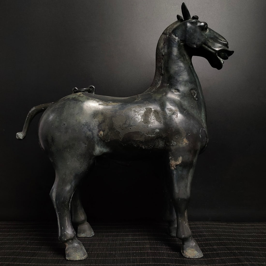 An Exquisite Bronze Horse Ornament,With Inscription: An Exquisite Bronze Horse Ornament,With Inscription,the Warring States period in China,Size:15.6inx14.2in,Weight:4500g,青铜马摆件,带铭文,中国
