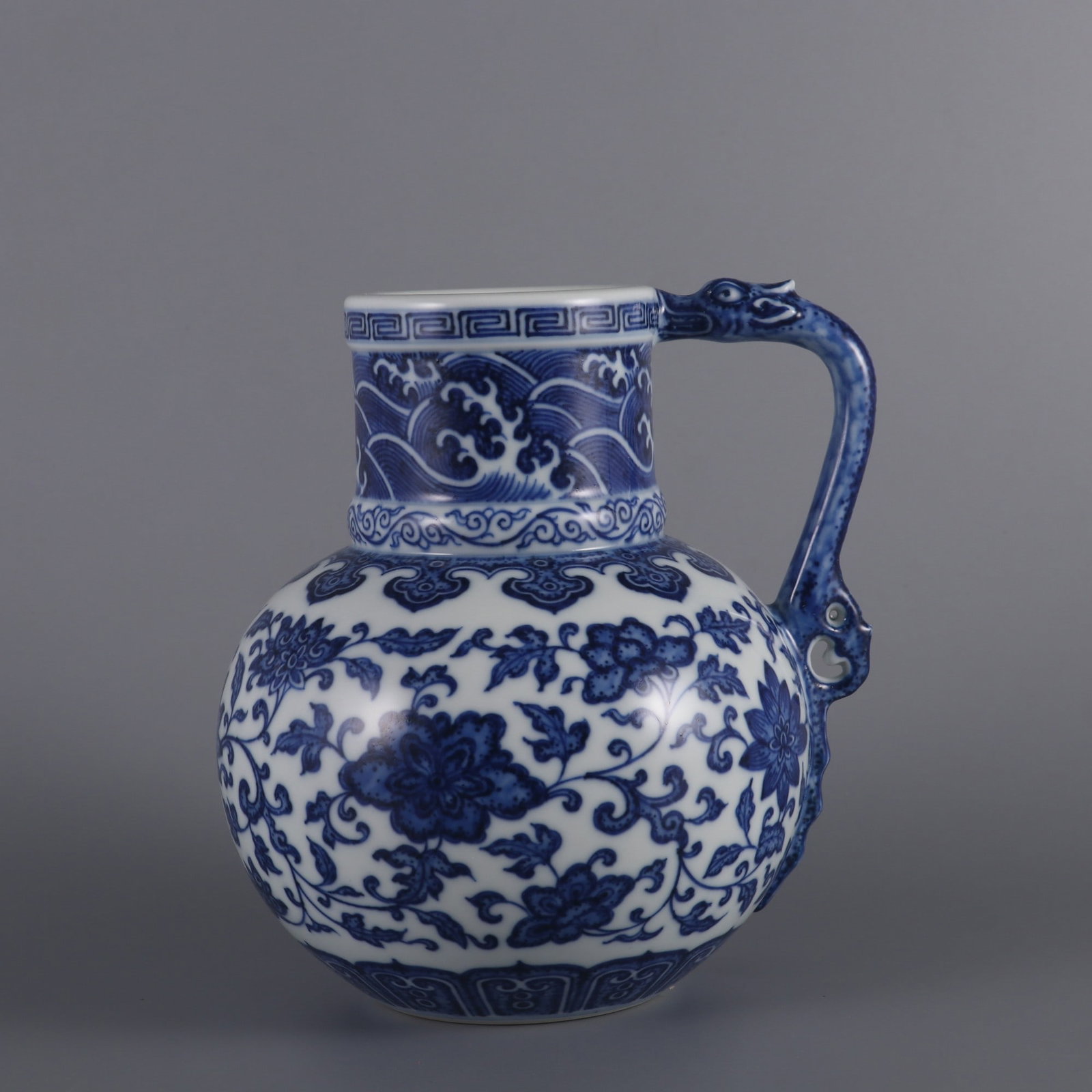 An Exquisite Blue and White Lotus Pattern Seawater Ewer: An Exquisite Blue and White Lotus Pattern Seawater Ewer,Qing Dynasty,China,Yongzheng Six-character Mark,Size:6.6inx5.3in,青花缠枝莲纹海水纹执
