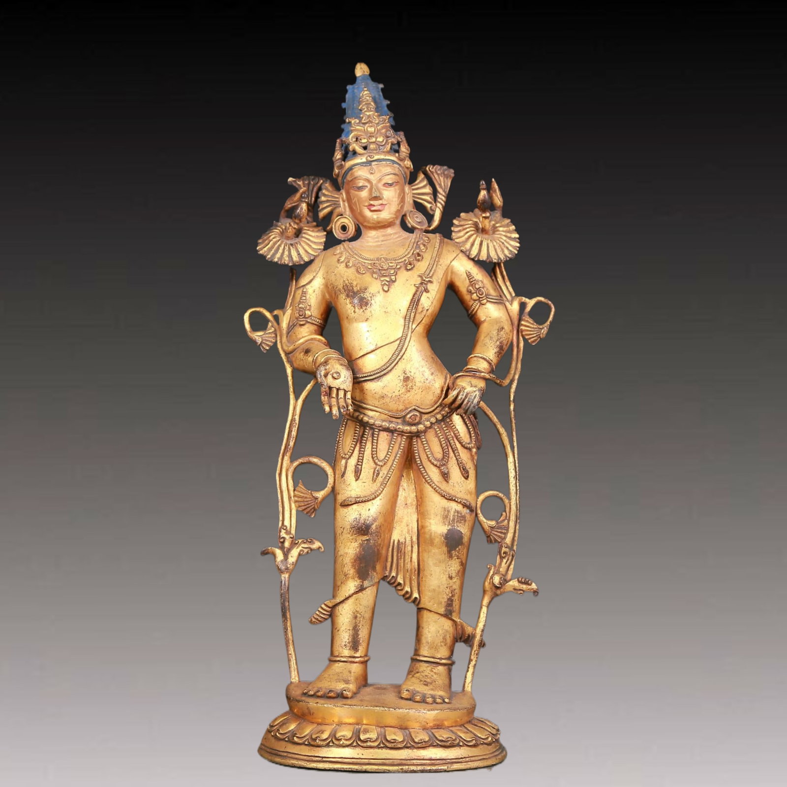 A solemn gilt bronze statue of Tara: A solemn gilt bronze statue of Tara with inscription,Ming Dynasty,China. Tara's posture is elegant,with a peaceful and compassionate expression. Her face is soft and A solemn,and her eyes are warm,as