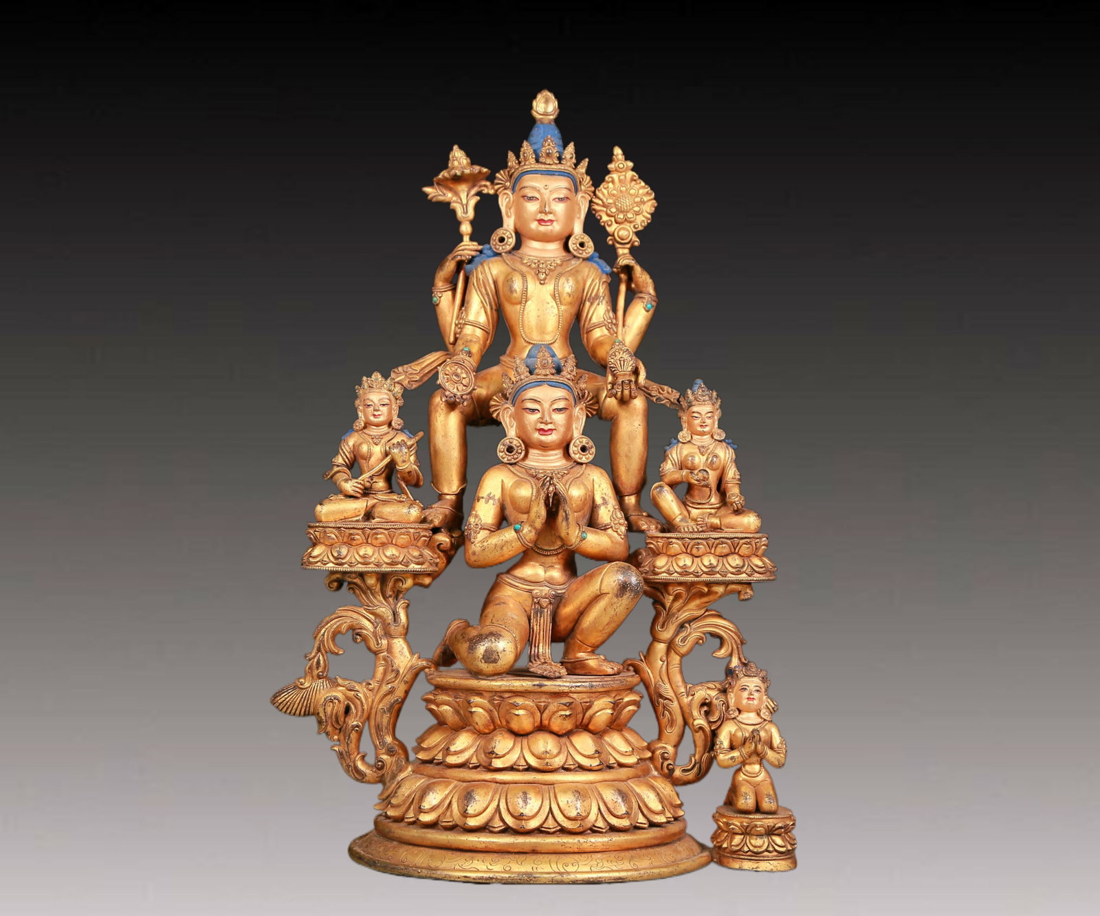 A solemn gilt bronze statue of Bodhisattva: A solemn gilt-bronze Bodhisattva statue,Ming Dynasty,China. The Bodhisattva's posture is graceful and peaceful. His face is A solemn and kind,and his eyes are deep,as if he can see into the suffering
