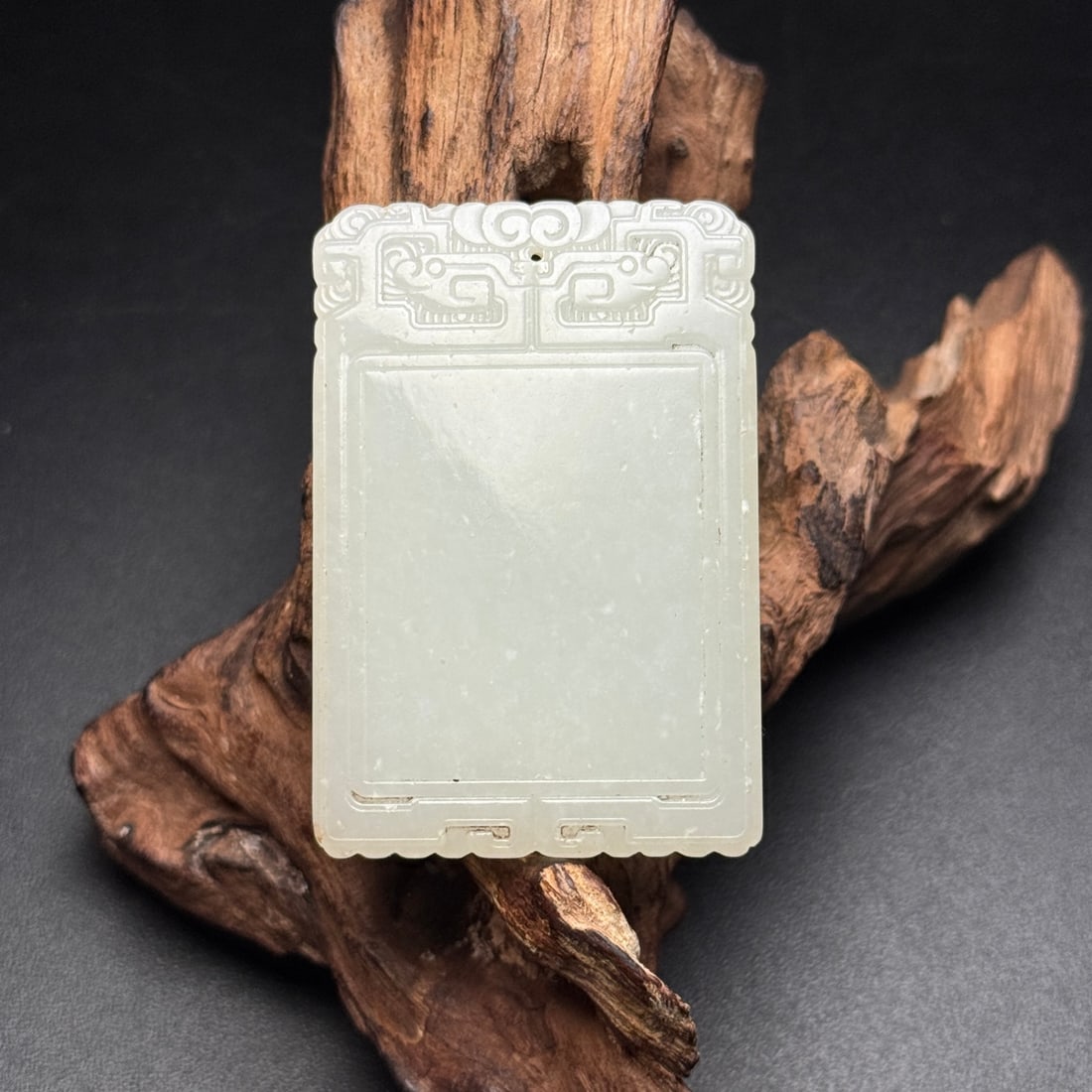 An Exquisite White Jade Auspicious Animal Pattern Pendant: An Exquisite White Jade Auspicious Animal Pattern Pendant,Qing Dynasty,China,Size:2.2inx1.5inx0.2in,Weight:34g,白玉瑞兽纹挂件,中国清代