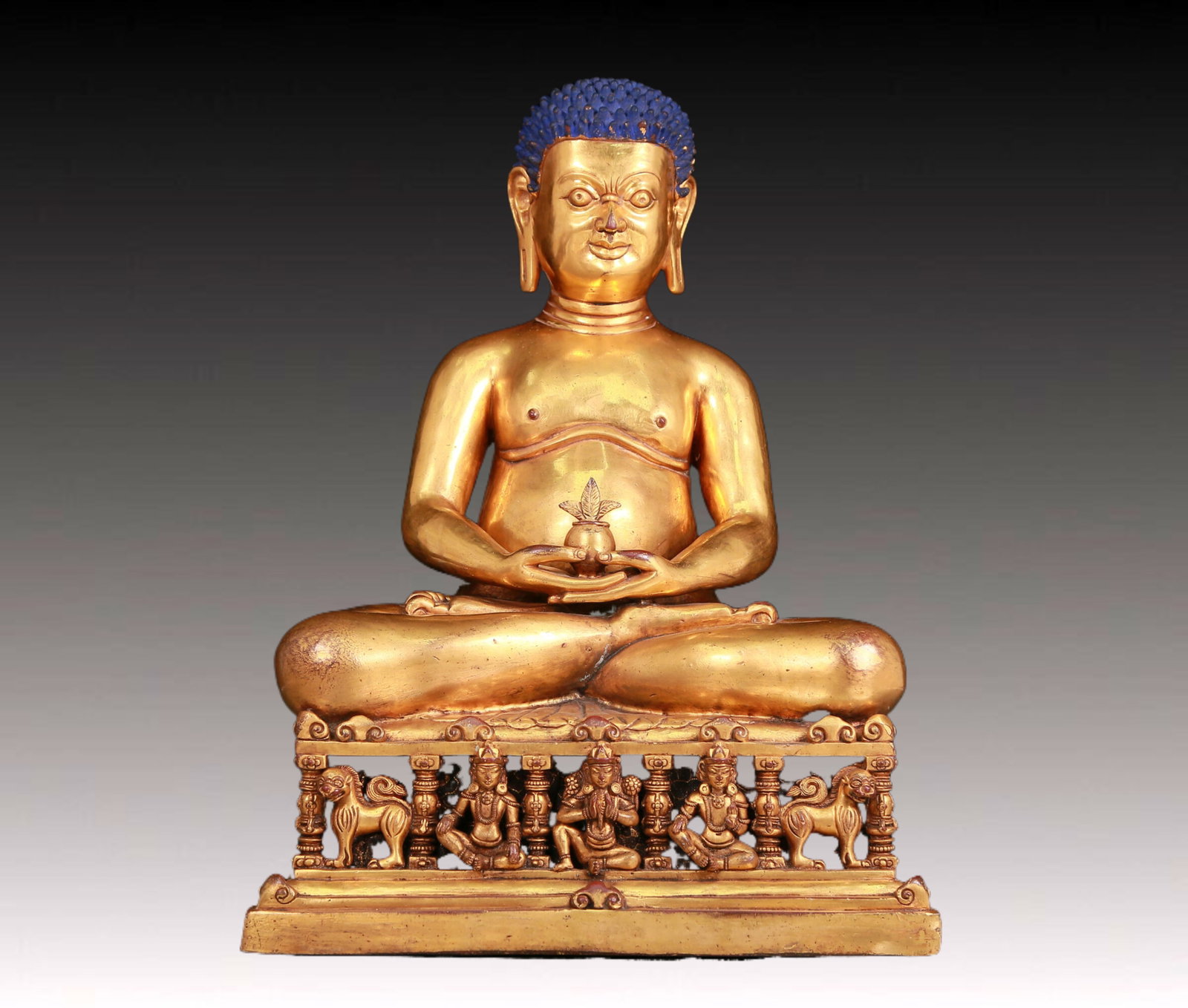 A solemn gilt bronze figure: A solemn gilt bronze figure with inscription,Qing Dynasty,China. The figure has clear facial contours and vivid expressions. Costumes,fabric textures and decorative details are crafted to life. The