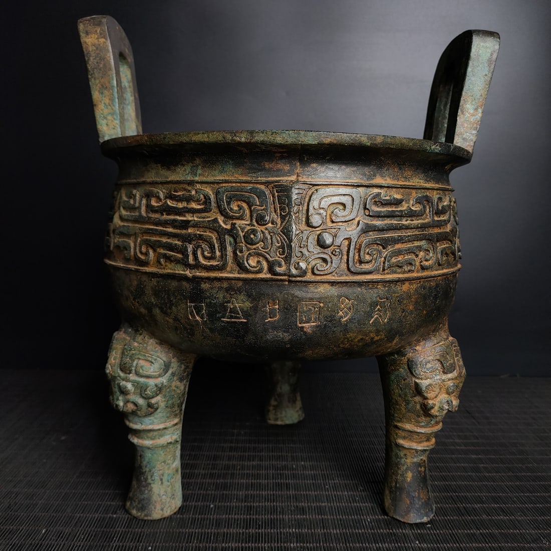 An Exquisite Bronze Beast-Face Pattern Double-Ears Tripod Censer,With Inscription: An Exquisite Bronze Beast-Face Pattern Double-Ears Tripod Censer,With Inscription,the Warring States period in China,Size:12.6inx10.6in,Weight:4800g,青铜兽面纹双