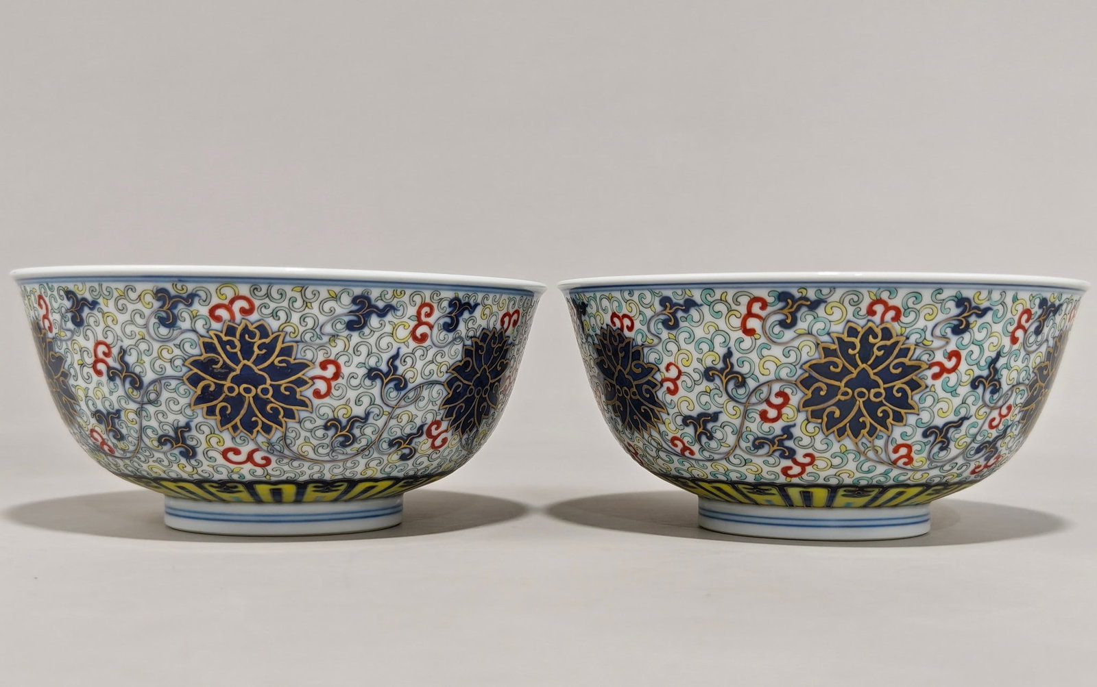 A Pair of Doucai Painted Gold Lotus Pattern Bowl: A Pair of Doucai Painted Gold Lotus Pattern Bowl,Qing Dynasty,China,with Guangxu Six-character Mark,Size:3.1inx6.5in 一对斗彩描金缠枝莲纹