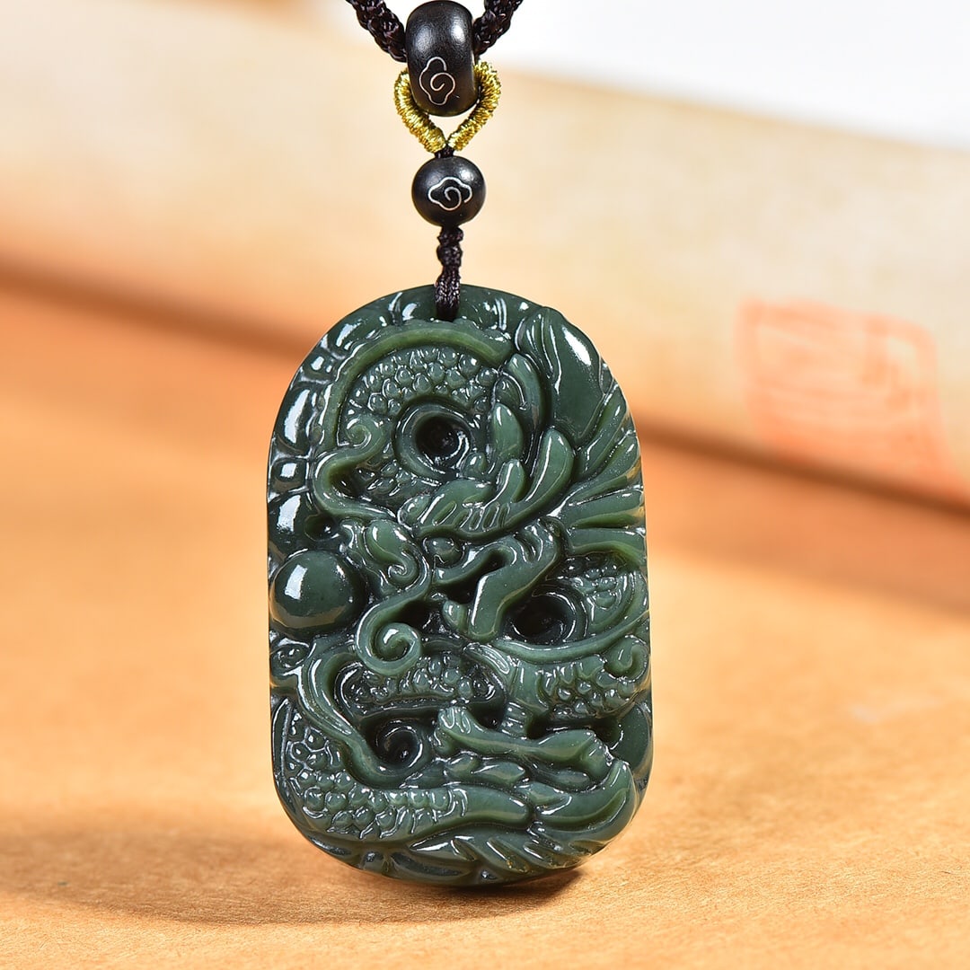 An Exquisite Sapphire Dragon Pattern Pendant: An Exquisite Sapphire Dragon Pattern Pendant,Size:33mmx53mm 青玉龙纹牌