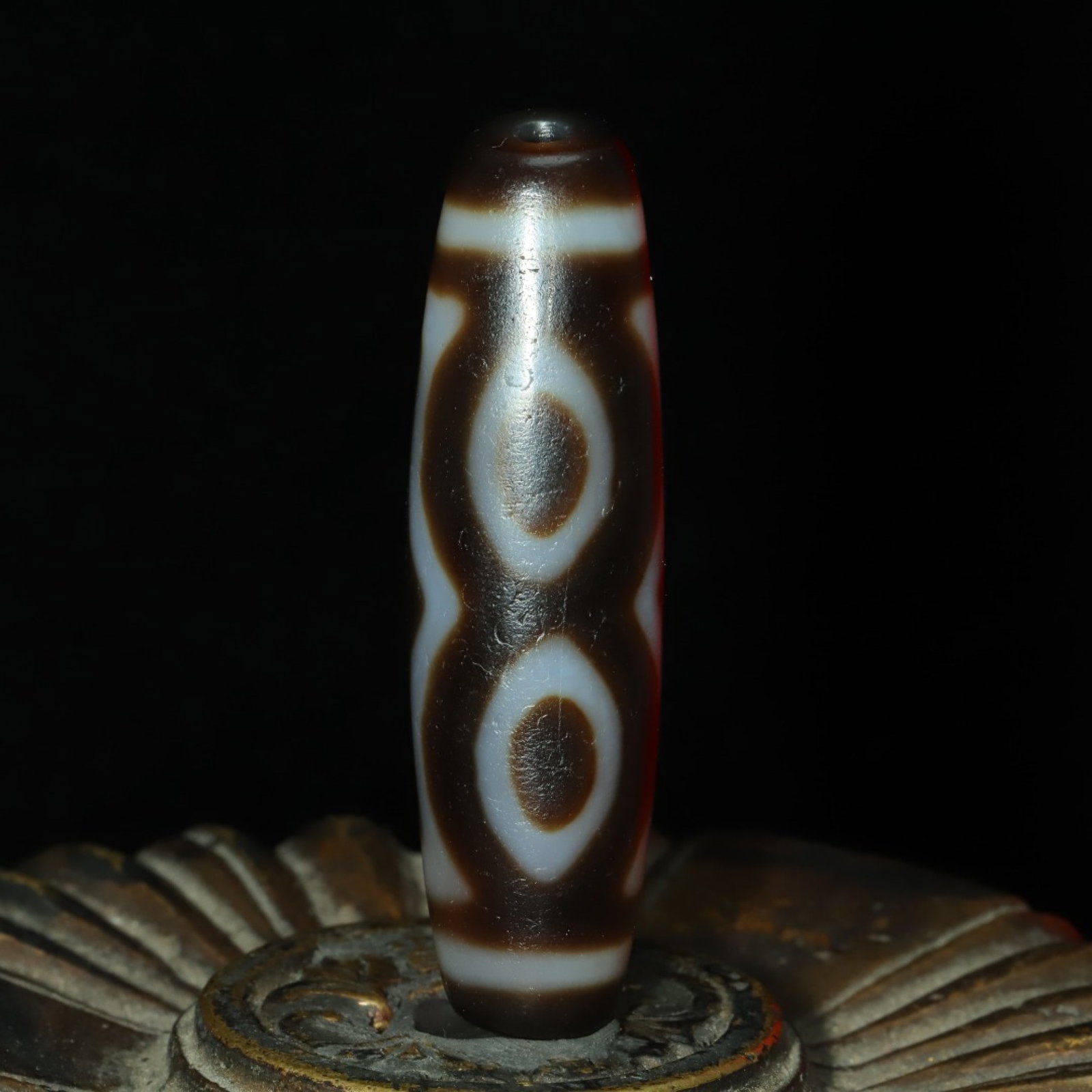 An Exquisite Three Eyes Dzi Bead Pendant: An Exquisite Three Eyes Dzi Bead Pendant,Size:48mmx13mm,Weight:14g 三眼天珠挂件