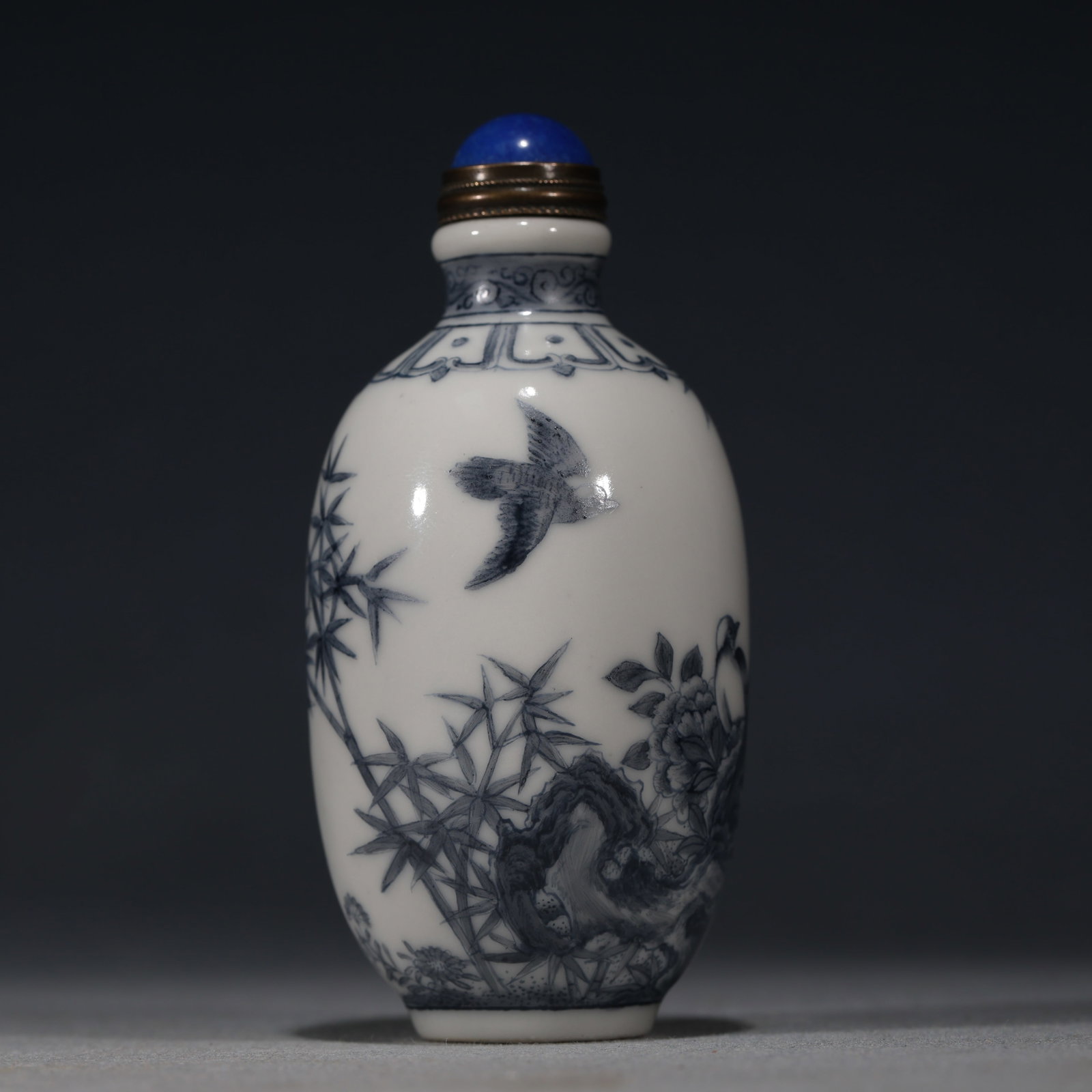 An Exquisite Blue And White Snuff Bottle With Flower,Bird,Bamboo And Rock Pattern: An Exquisite Blue And White Snuff Bottle With Flower,Bird,Bamboo And Rock Pattern,China,Qing Dynasty,Four-Character Qianlong Mark,Dimensions:3.3inx1.6in,青花花鸟竹石