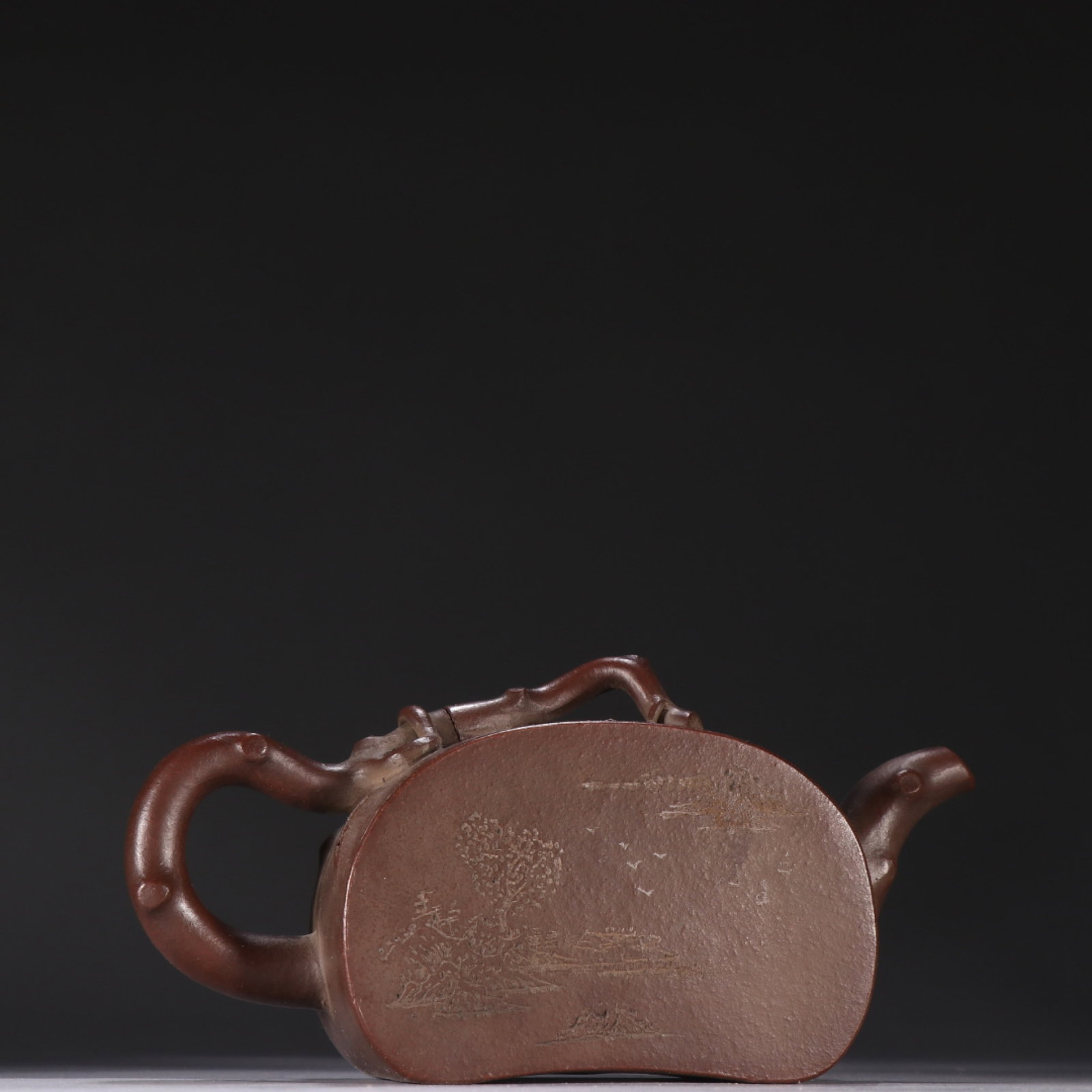 A Rare Purple Sands Landscape Pattern Teapot,with poem: A Rare Purple Sands Landscape Pattern Teapot,with poem,Qing Dynasty,China,Qianlong Four-character Mark,Size:3.5inx6.5in