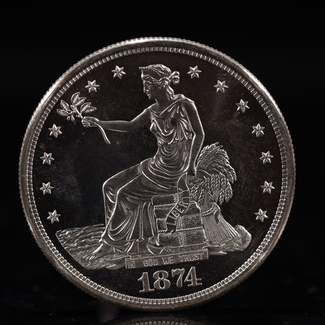 USA Trade Dollar 1874 Coin: American coin. Obverse: Liberty seated on a pedestal facing the sea to the left holding olive branches surrounded by 13 stars. IN GOD WE TRUST / LIBERTY / 1874. Reverse: An eagle holding branches with