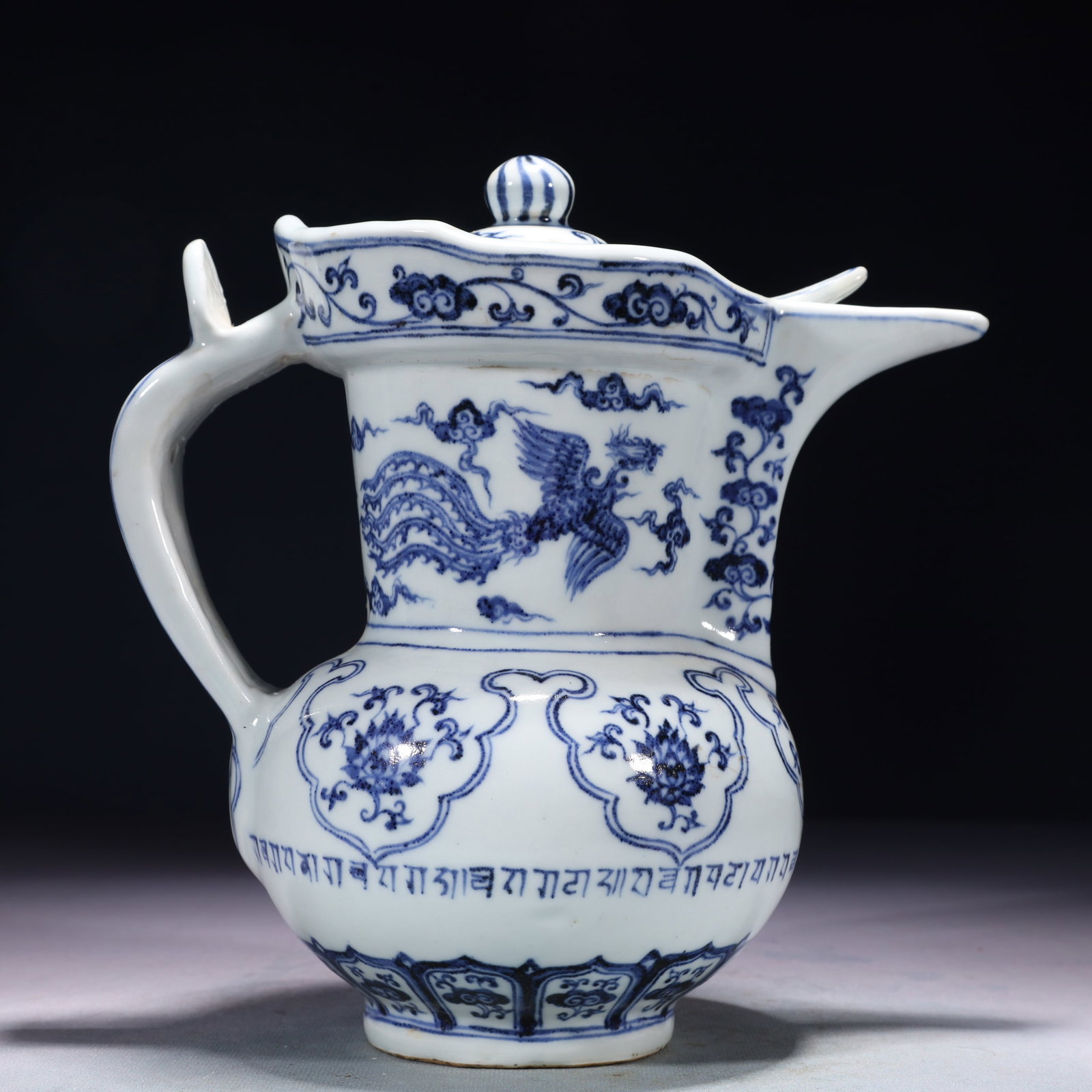 An Exquisite Blue and White Auspicious Cloud and Phoenix Pattern Pot,With Sanskrit: An Exquisite Blue and White Auspicious Cloud and Phoenix Pattern Pot,With Sanskrit,Ming Dynasty,China,Xuande Six-character Mark,Size:9.1inx5.1inx9.4in,Weight:1700g