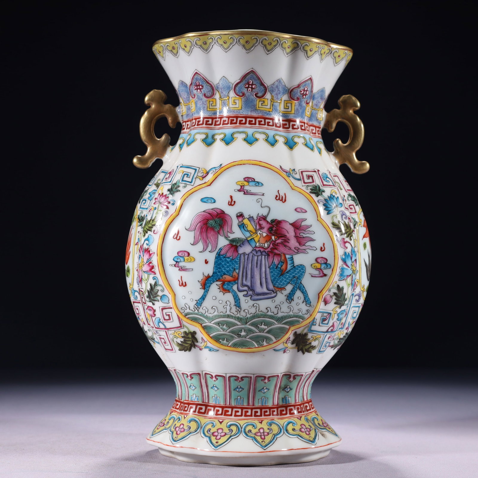 An Exquisite Famille-Rose Painted Gold Lotus and Kylin Pattern Double-Ears Vase: An Exquisite Famille-Rose Painted Gold Lotus and Kylin Pattern Double-Ears Vase,Qing Dynasty,China,Qianlong Six-character Mark,Size:5.9inx4.7inx10.6in,Weight:1500g 粉彩描金 