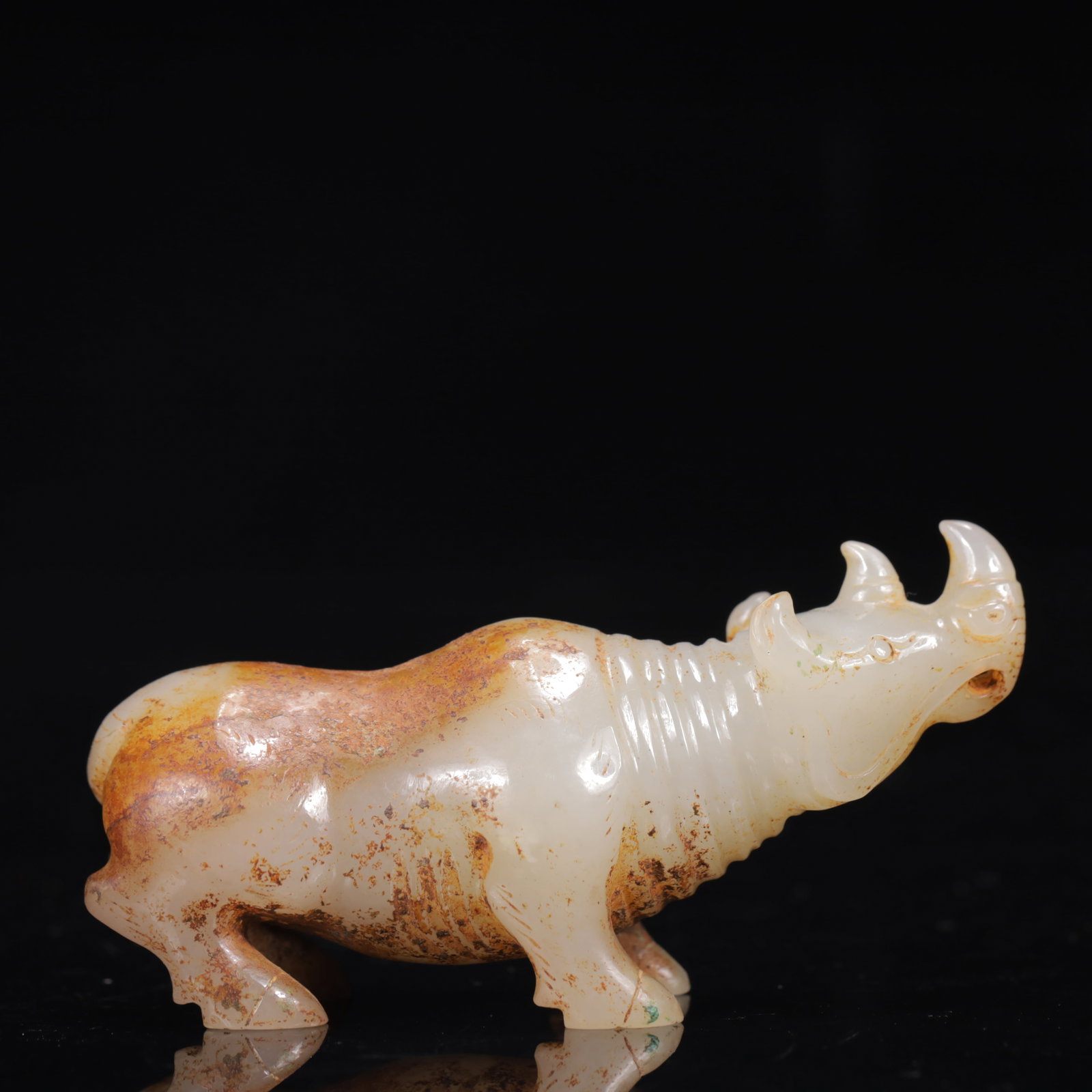 An Exquisite White Jade Rhinoceros Ornament: An Exquisite White Jade Rhinoceros Ornament,Qing Dynasty,China,Size:3.1inx1inx1.4in,Weight:88g 白玉犀牛摆件,中国清代