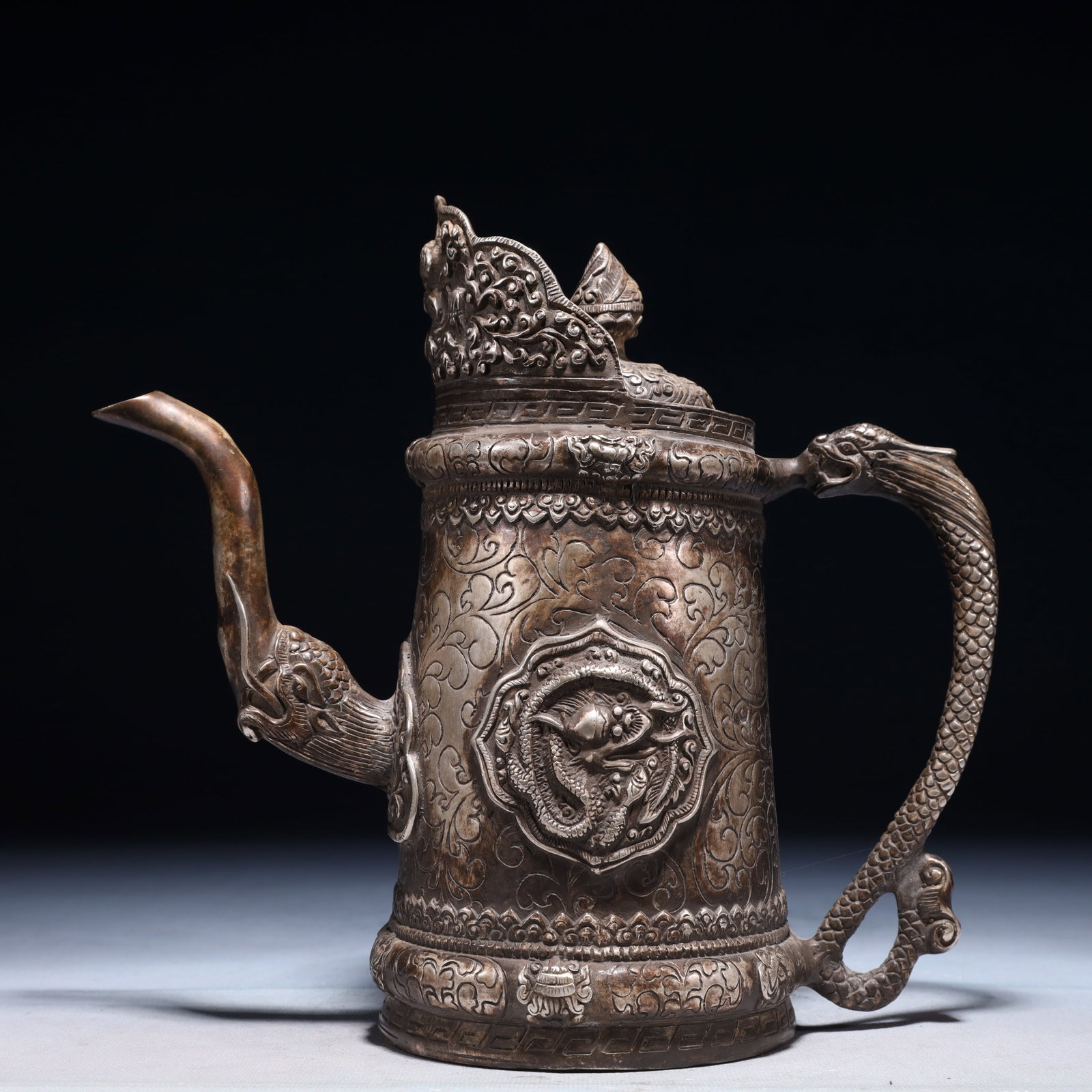An Exquisite Silver-plated Bronze Auspicious Cloud and Dragon Pattern Ewer: An Exquisite Silver-plated Bronze Auspicious Cloud and Dragon Pattern Ewer,Qing Dynasty,China,Size:8.7inx4.3inx9.1in,Weight:1350g 铜镀银祥云龙纹执ࣥ