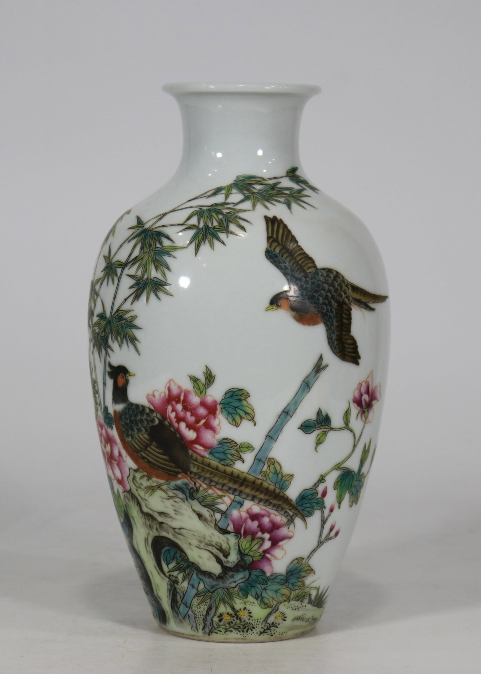 A fine falangcai vase with flower and bird pattern: A fine falangcai vase with flower and bird pattern, Qing Dynasty, China, with six-character Qianlong reign mark, Size:8.8inx2.6inA fine falangcai vase with flower and bird pattern, Qing Dynasty, China