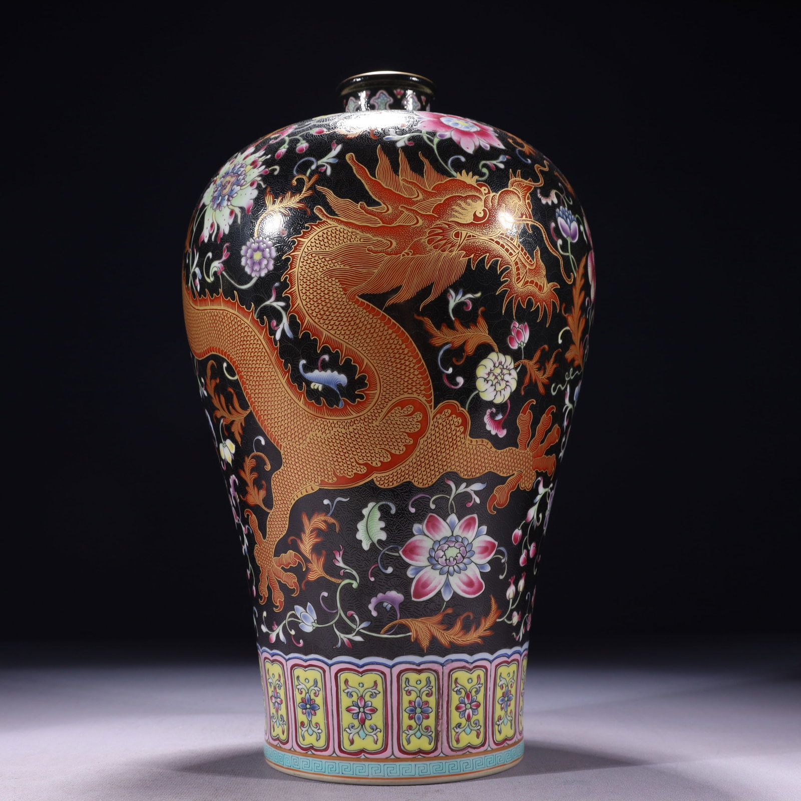 An Exquisite Black Ground Famille-Rose Painted Gold Flower and Dragon Pattern Vase: An Exquisite Black Ground Famille-Rose Painted Gold Flower and Dragon Pattern Vase,Qing Dynasty,China,Qianlong Six-character Mark,Size:7.1inx13.4in,Weight:2650g 黑地粉彩描
