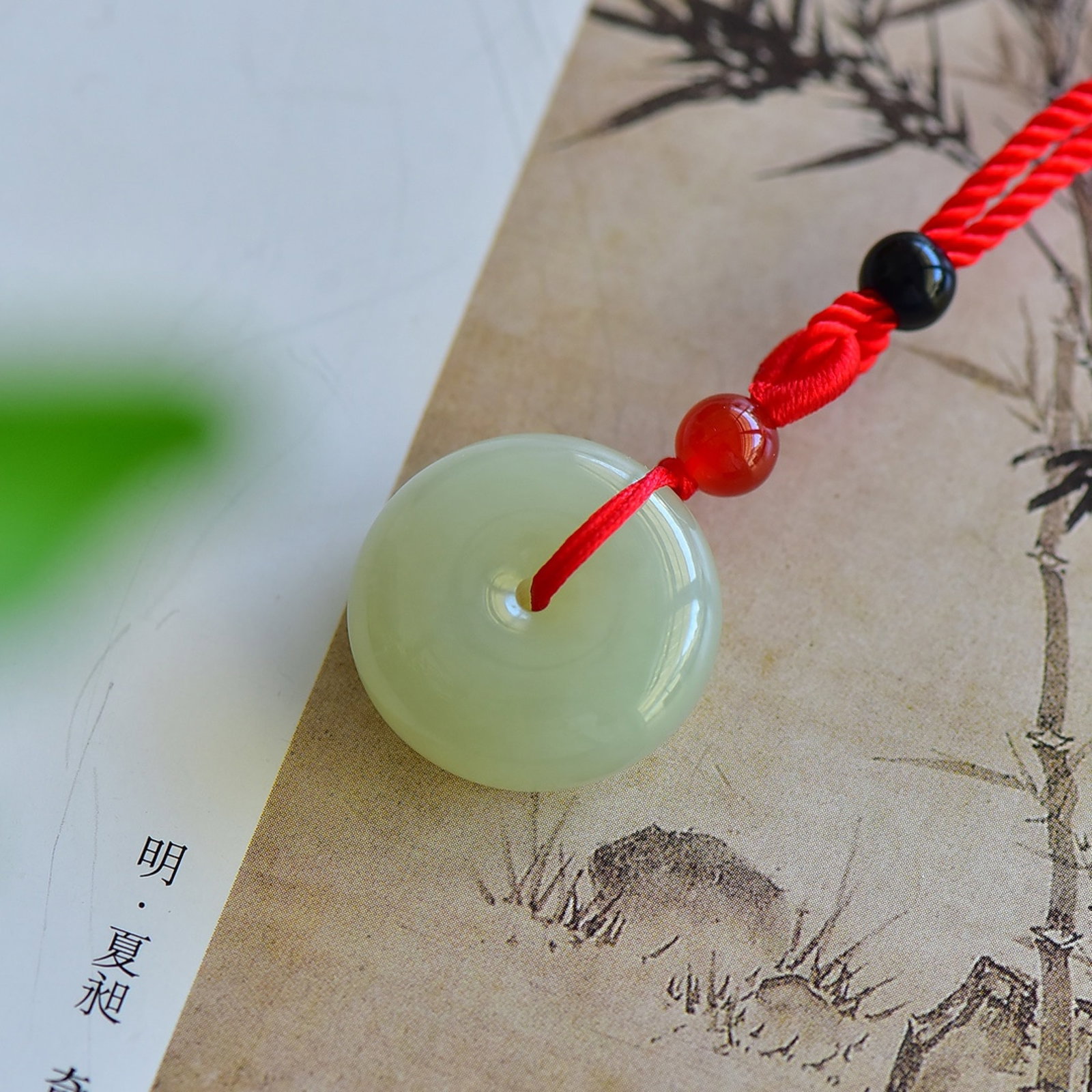 An Exquisite Greenish Jade Pendant