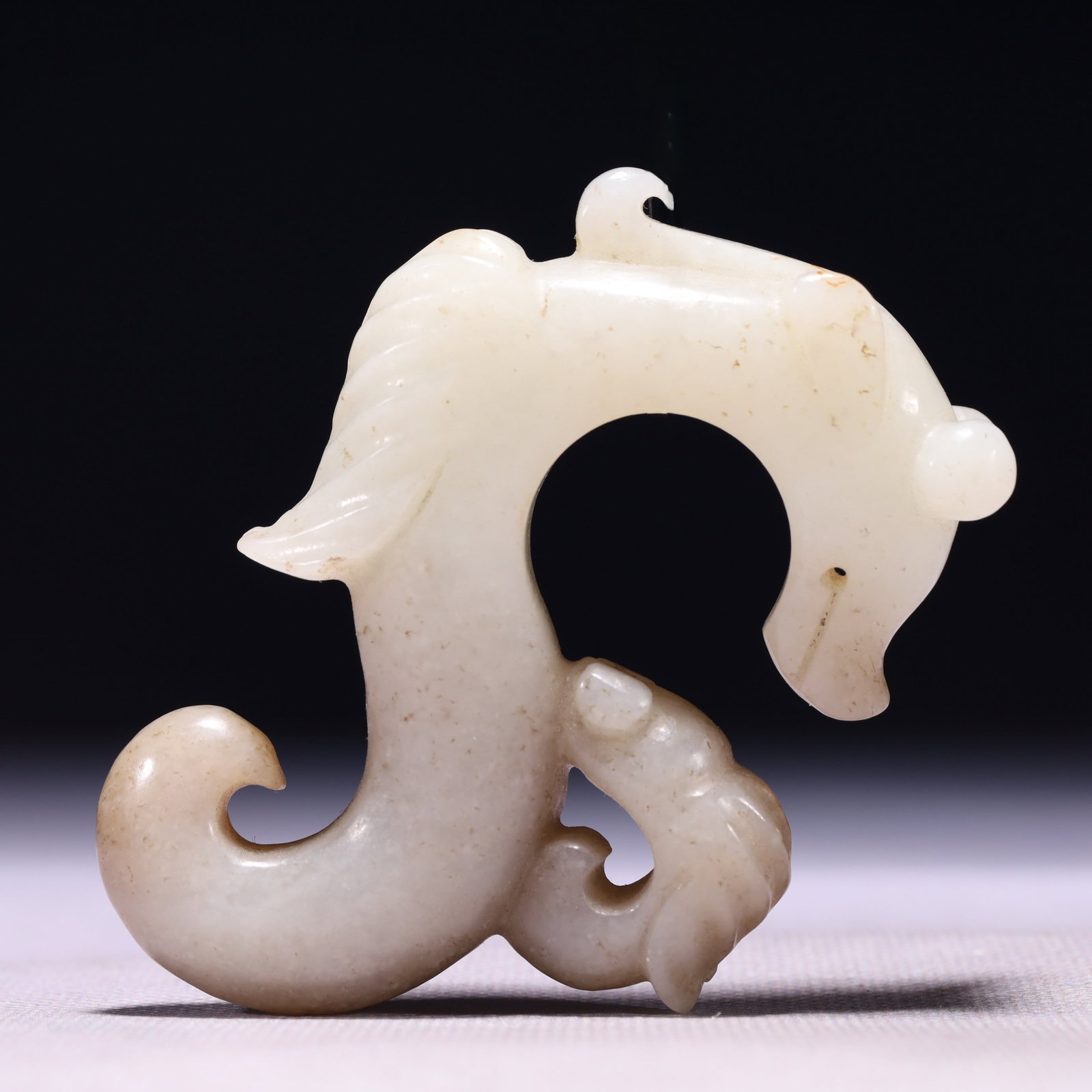 An Exquisite White Jade Dragon Pendant