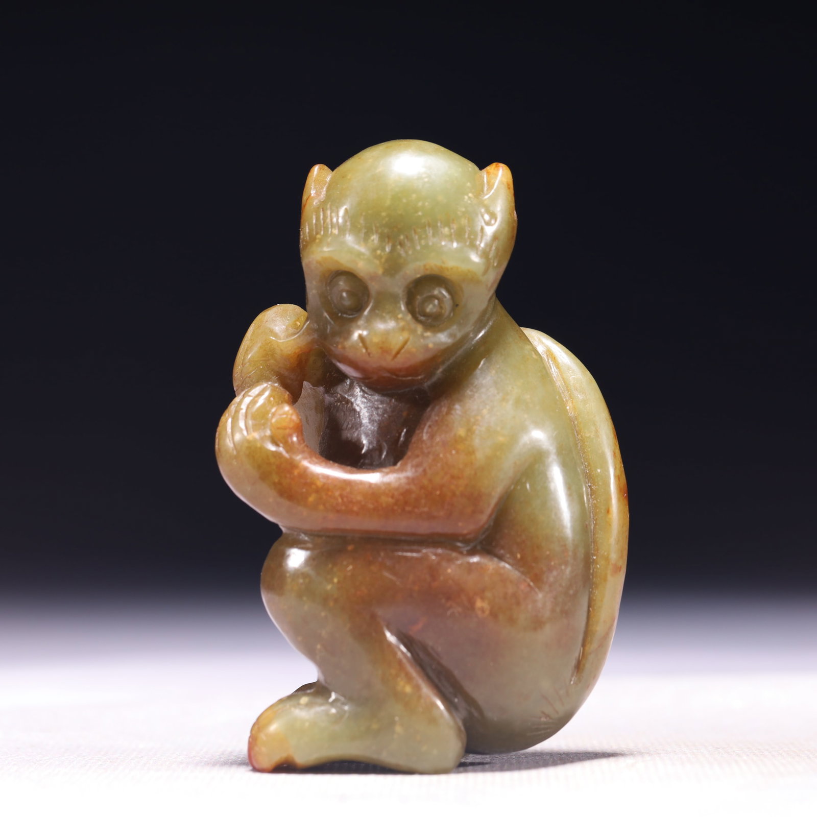 An Exquisite Green Jade Monkey Ornament