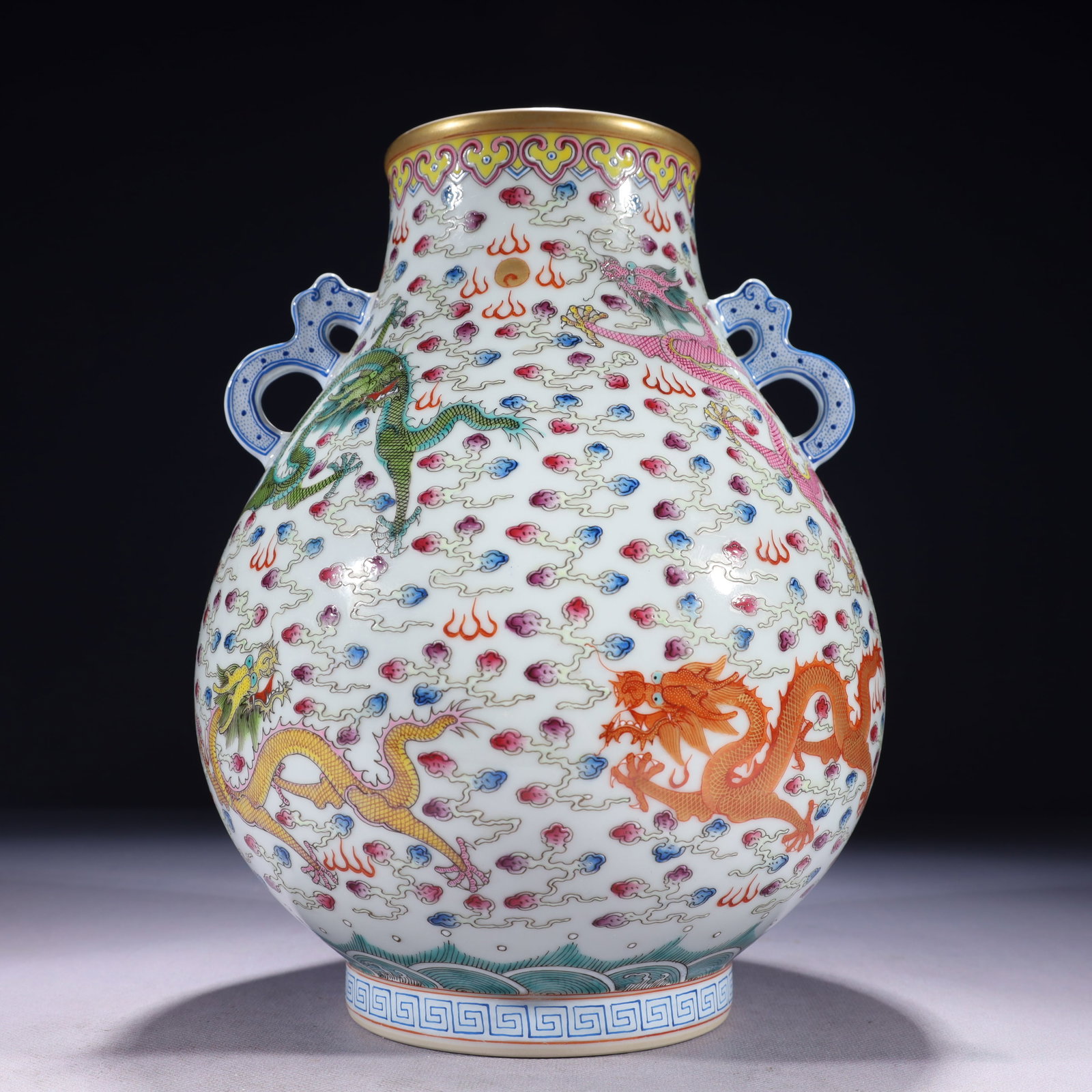 An Exquisite Famille-Rose Painted Gold Auspicious Cloud and Dragon Pattern Double-Ears Vase: An Exquisite Famille-Rose Painted Gold Auspicious Cloud and Dragon Pattern Double-Ears Vase,Qing Dynasty,China,Yongzheng Six-character Mark,Size:7.5inx10.6in,Weight:2250g 粉彩描ŵ
