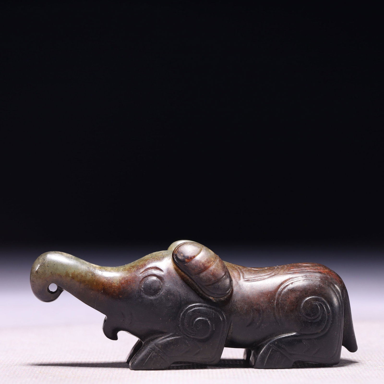 An Exquisite Archaic Jade Elephant Ornament (1 of 8)