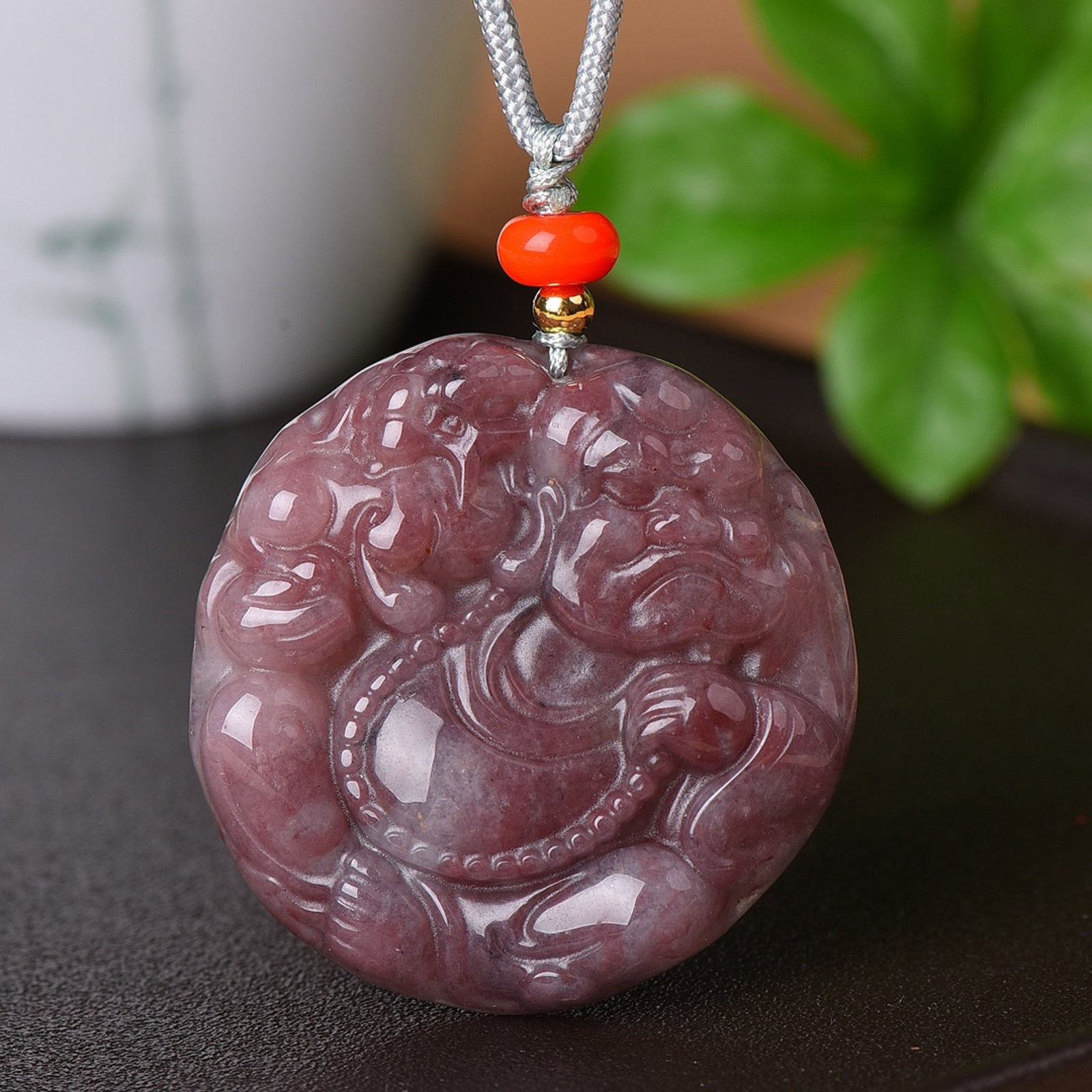 An Exquisite Red Jade Figure Pattern Pendant