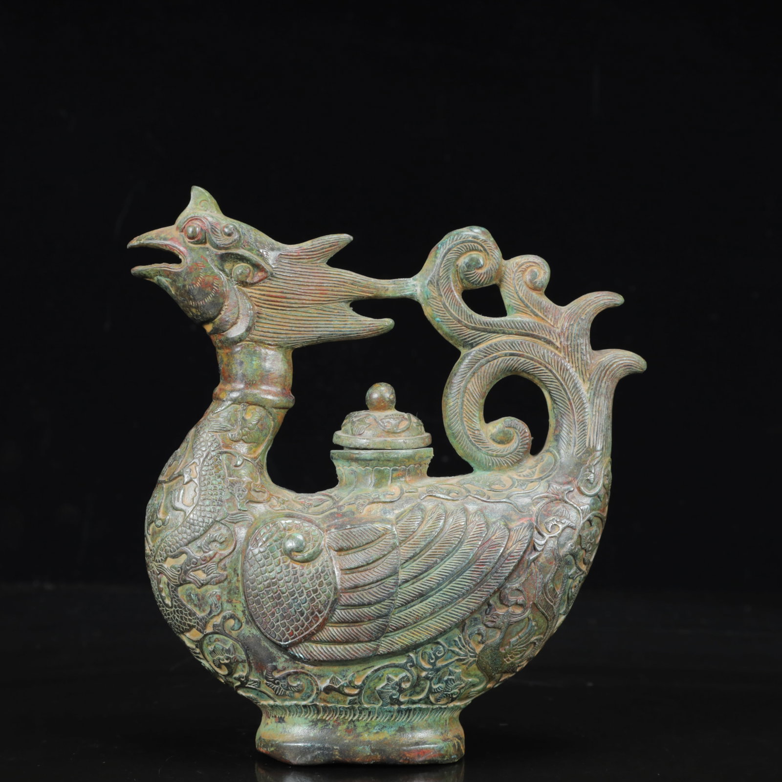 An Archaic Bronze Dragon and Phoenix Pattern Rooster Pot: An Archaic Bronze Dragon and Phoenix Pattern Rooster Pot,the Warring States Period in China,Size:6.7inx3.1inx7.5in,Weight:900g 青铜龙凤纹鸡壶,中国