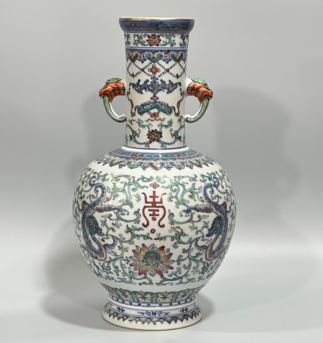 A Rare Blue and White Doucai Lotus and Dragon Pattern Double-Ears Vase: A Rare Blue and White Doucai Lotus and Dragon Pattern Double-Ears Vase,Qing Dynasty,China,Qianlong Six-character Mark,Size:13.4inx7.1in 青花斗彩缠枝莲龙