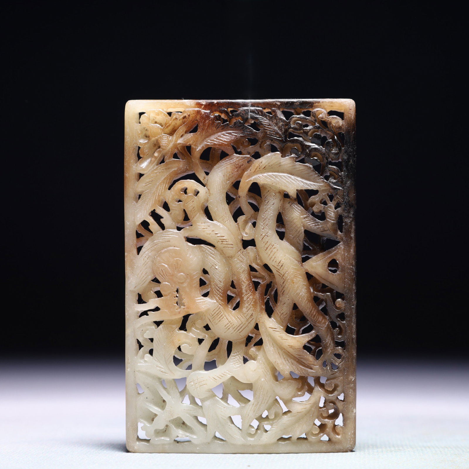 An Exquisite White Jade Flower and Dragon Pattern Pendant: An Exquisite White Jade Flower and Dragon Pattern Pendant,Qing Dynasty,China,Size:3.5inx2.2in,Weight:87.7g 白玉花卉龙纹佩,中国清代