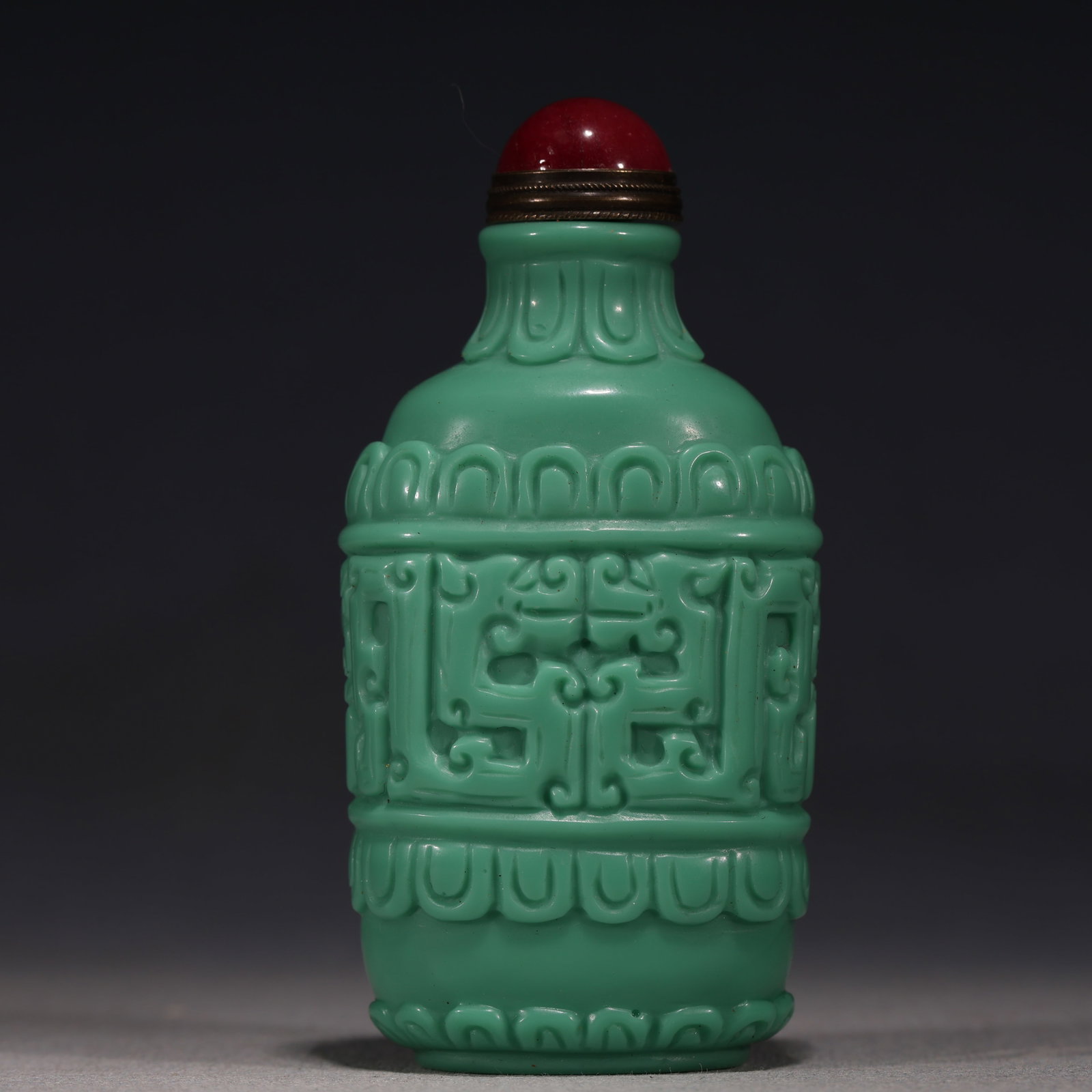 An Exquisite Turquoise Green Glass Relief Cloud Dragon Pattern Snuff Bottle: An Exquisite Turquoise Green Glass Relief Cloud Dragon Pattern Snuff Bottle,Qing Dynasty, China,Qianlong Four-character Mark,Size:1.6in×1.2in×3.3in 松石绿琉璃&#
