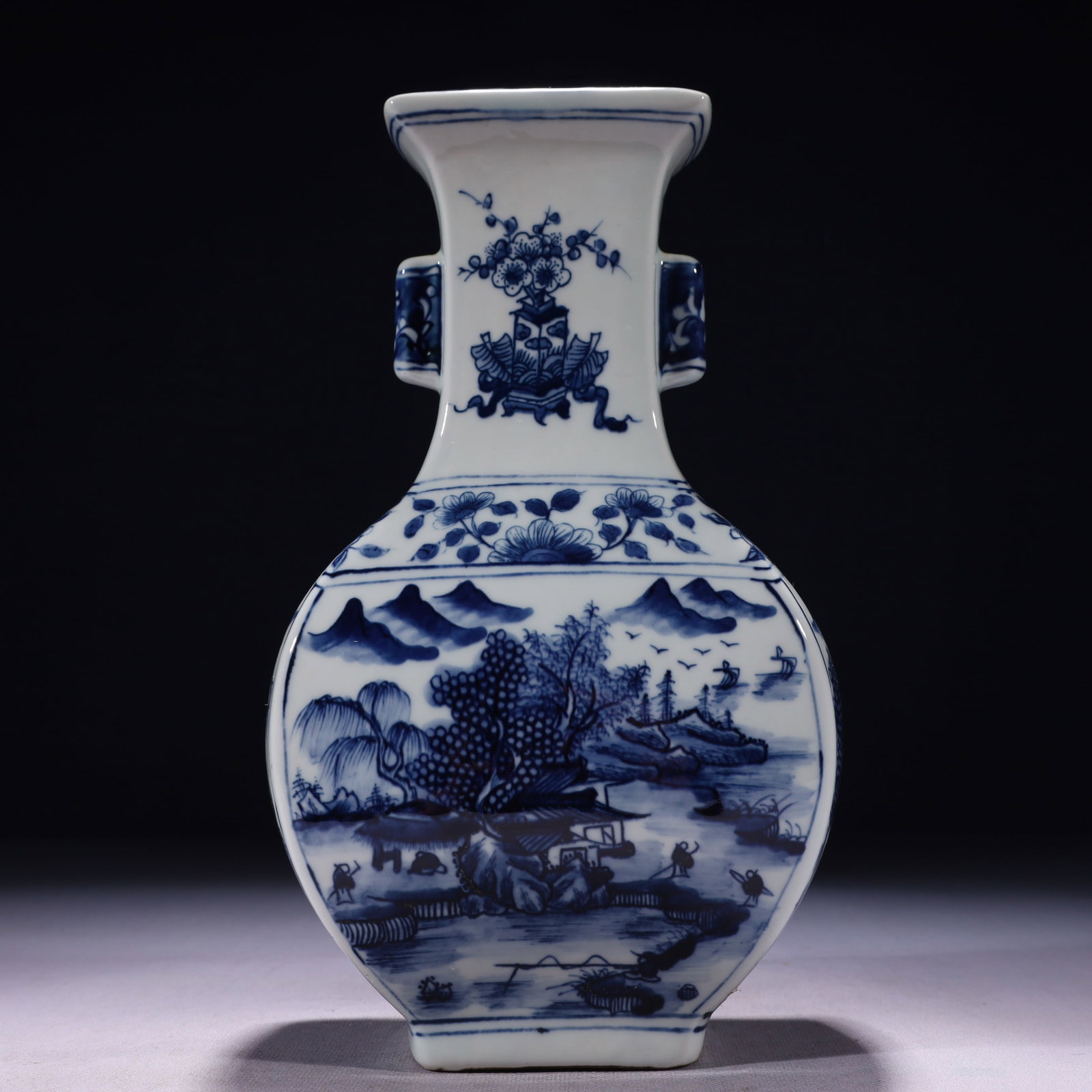 An Exquisite Blue and White Landscape and Figure Pattern Double-Ears Vase: An Exquisite Blue and White Landscape and Figure Pattern Double-Ears Vase,Qing Dynasty,China,Kangxi Six-character Mark,Size:5.9inx3.5inx10.2in,Weight:950g 青花山水人Ĥ