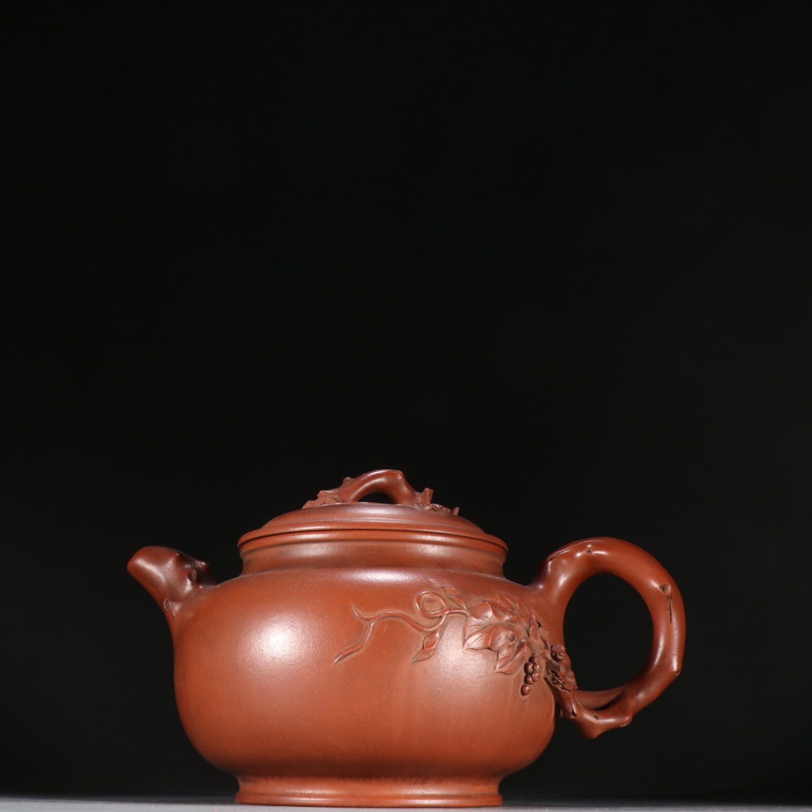 A Rare Purple Sands Squirrel and Grapes Pattern Teapot: A Rare Purple Sands Squirrel and Grapes Pattern Teapot,Qing Dynasty,China,Wang Yinxian Mark,Size:8.5inx4.9in 紫砂松鼠葡萄纹茶壶,中国&#