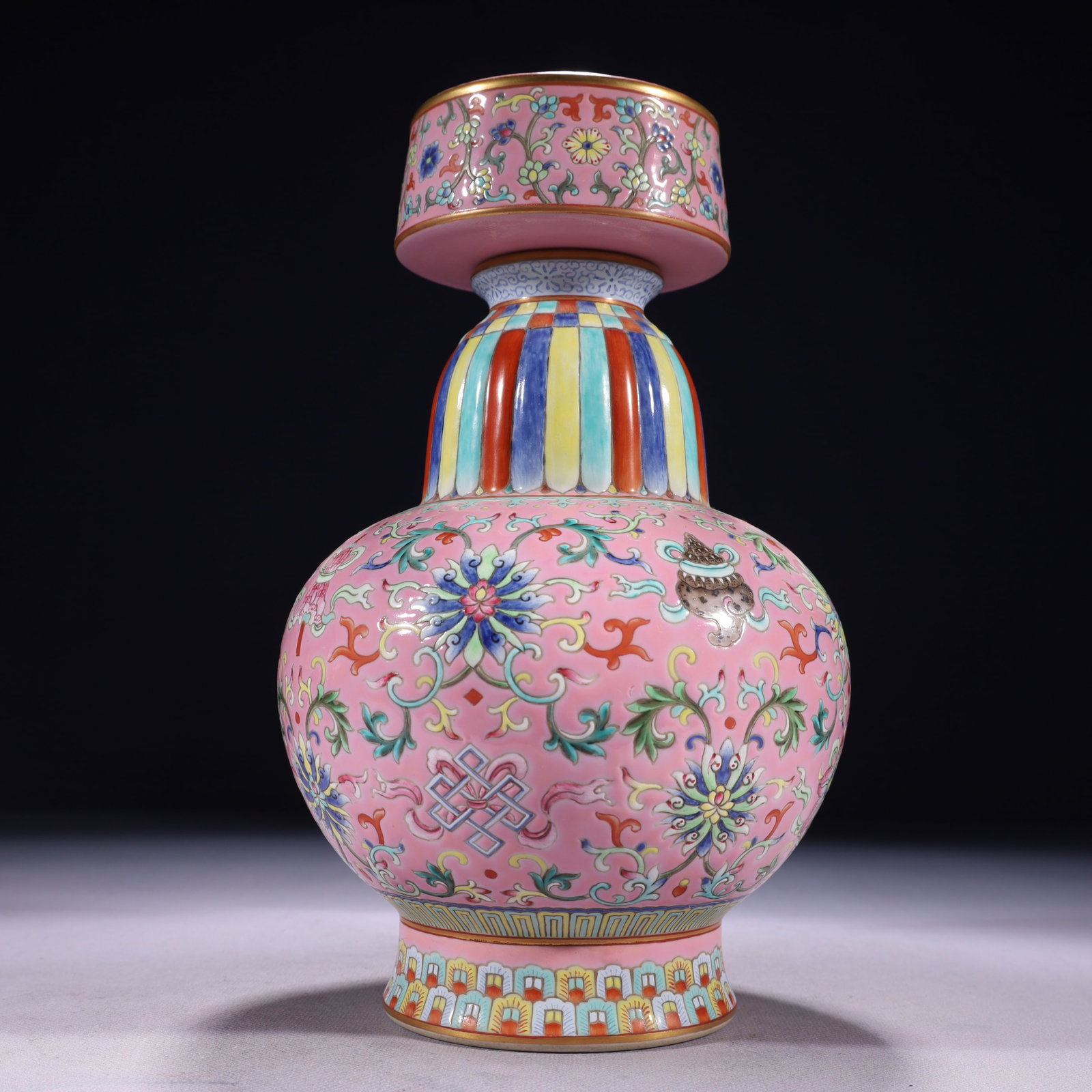 An Exquisite Pink Ground Famille-Rose Painted Gold Lotus and Eight Treasures Pattern Pot: An Exquisite Pink Ground Famille-Rose Painted Gold Lotus and Eight Treasures Pattern Pot,Qing Dynasty,China,Qianlong Six-character Mark,Size:5.9inx11in,Weight:1550g