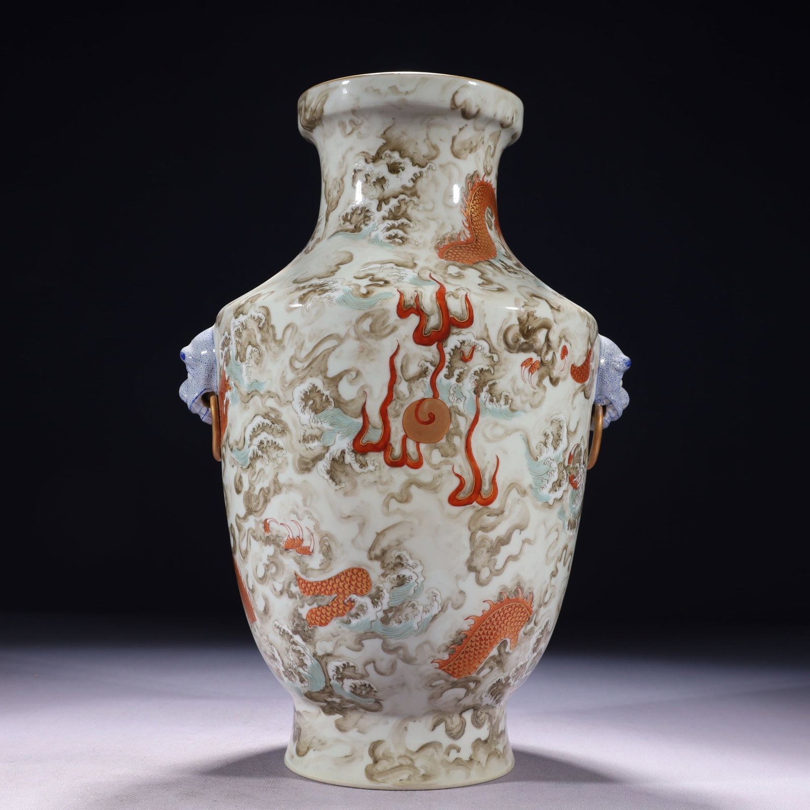 An Exquisite Ink Color Iron-Red Painted Gold Seawater and Dragon Pattern Beast-Ears Vase: An Exquisite Ink Color Iron-Red Painted Gold Seawater and Dragon Pattern Beast-Ears Vase,Qing Dynasty,China,Qianlong Six-character Mark,Size:7.9inx12.2in,Weight:1850g