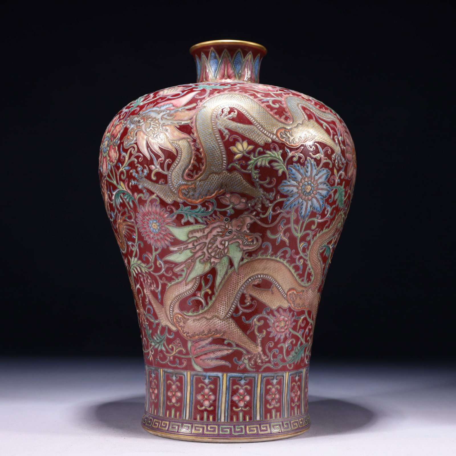 An Exquisite Red Ground Famille-Rose Painted Gold Lotus and Dragon Pattern Vase: An Exquisite Red Ground Famille-Rose Painted Gold Lotus and Dragon Pattern Vase 红地粉彩描金缠枝莲龙纹瓶,中国清