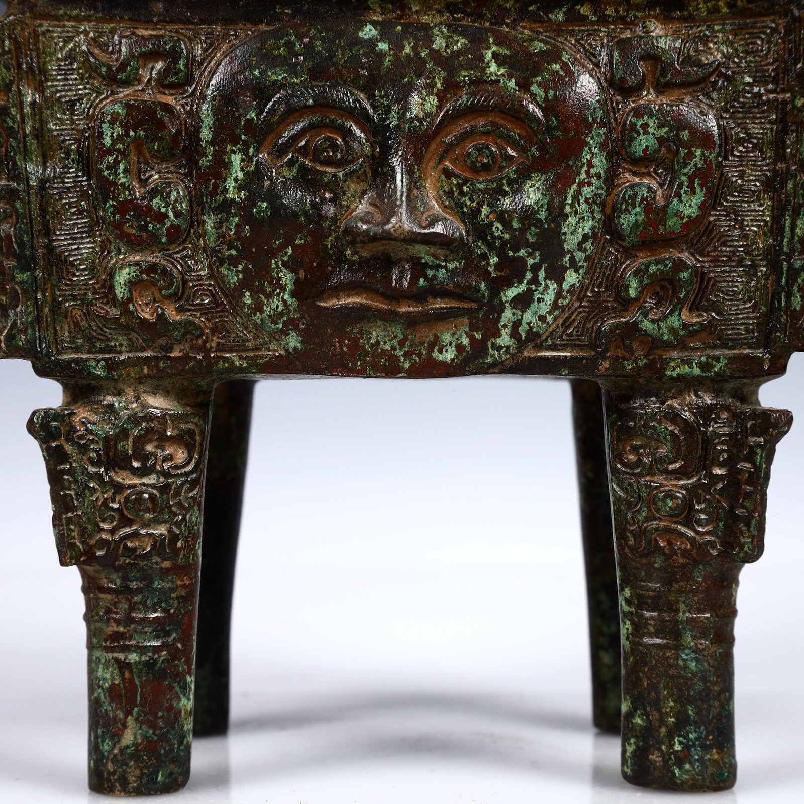 A Rare Bronze Human-Face Pattern Ding - 3