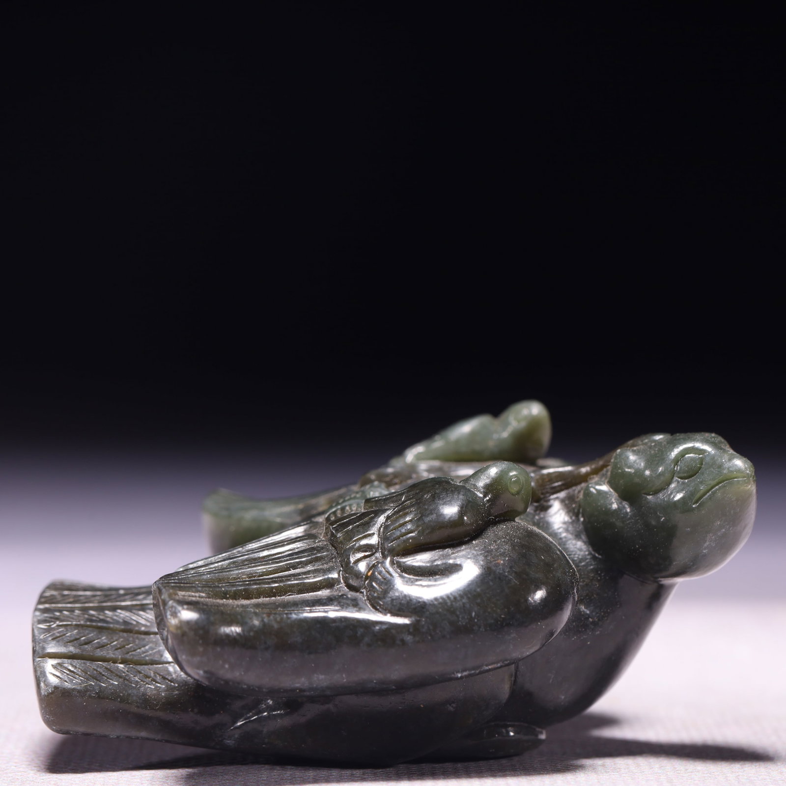 A Rare Green Jade Phoenix Ornament: A Rare Green Jade Phoenix Ornament,Qing Dynasty,China,Size:3inx2.4inx1.2in,Weight:129g 青玉凤摆件,中国清代