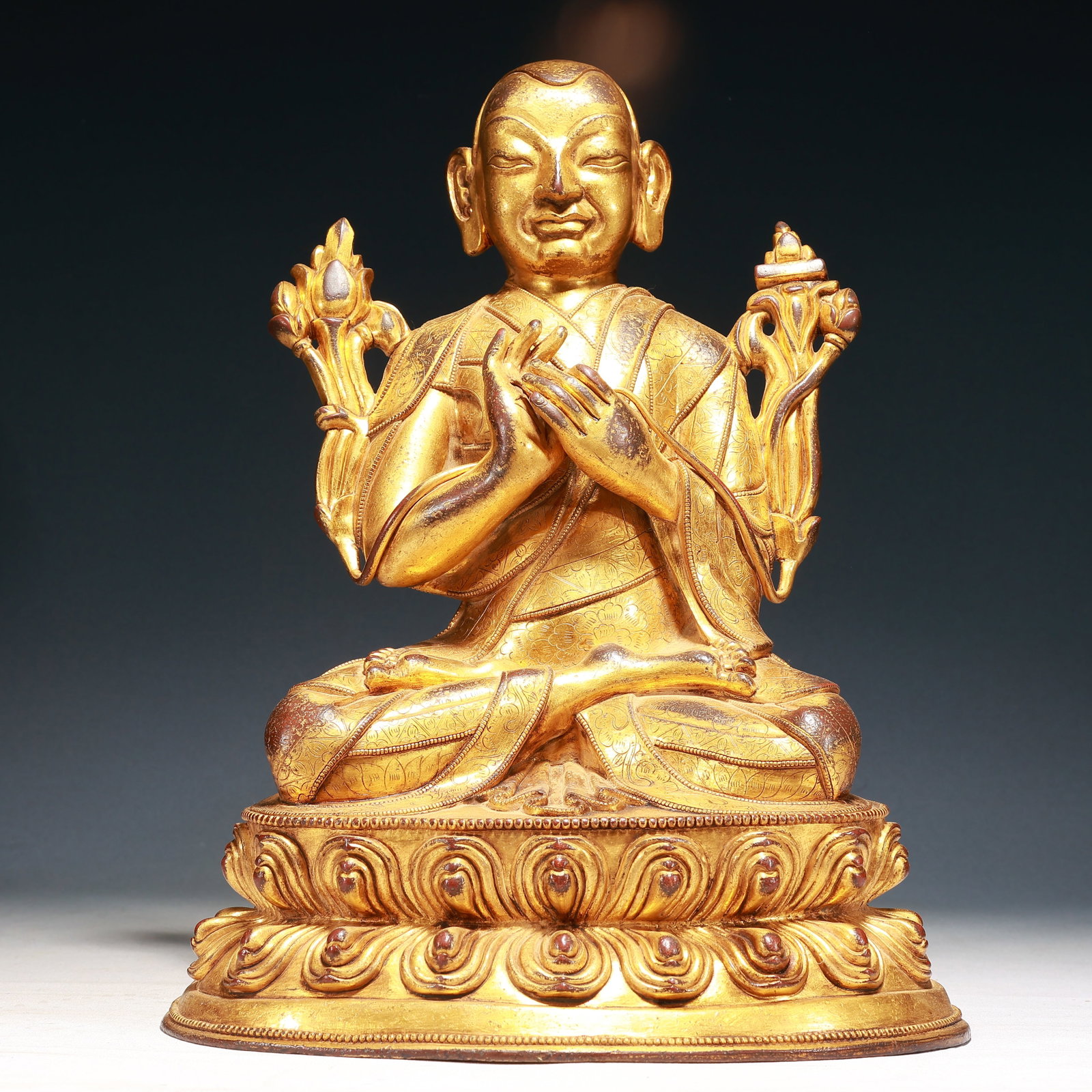 A Solemn Gilt Bronze Flower Pattern Statue of Guru: A Solemn Gilt Bronze Flower Pattern Statue of Guru,Qing Dynasty,China,Size:11inx7.9inx15.7in,Weight:10550g 铜鎏金花卉纹上师像,中国