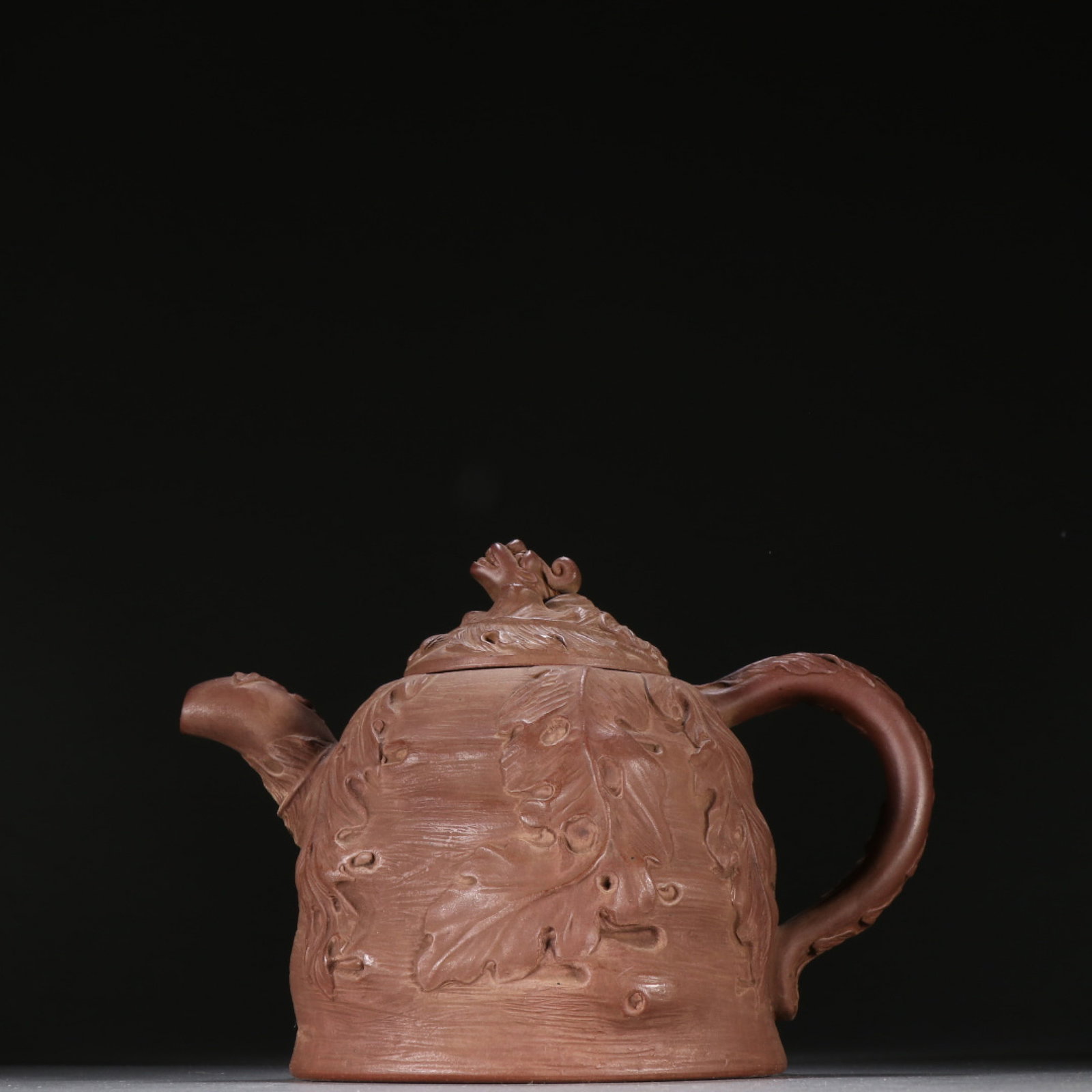A Rare Purple Sands Banana Leaf Pattern Teapot: A Rare Purple Sands Banana Leaf Pattern Teapot,Qing Dynasty,China,Gongju Mark,Size:5.5inx7.5in