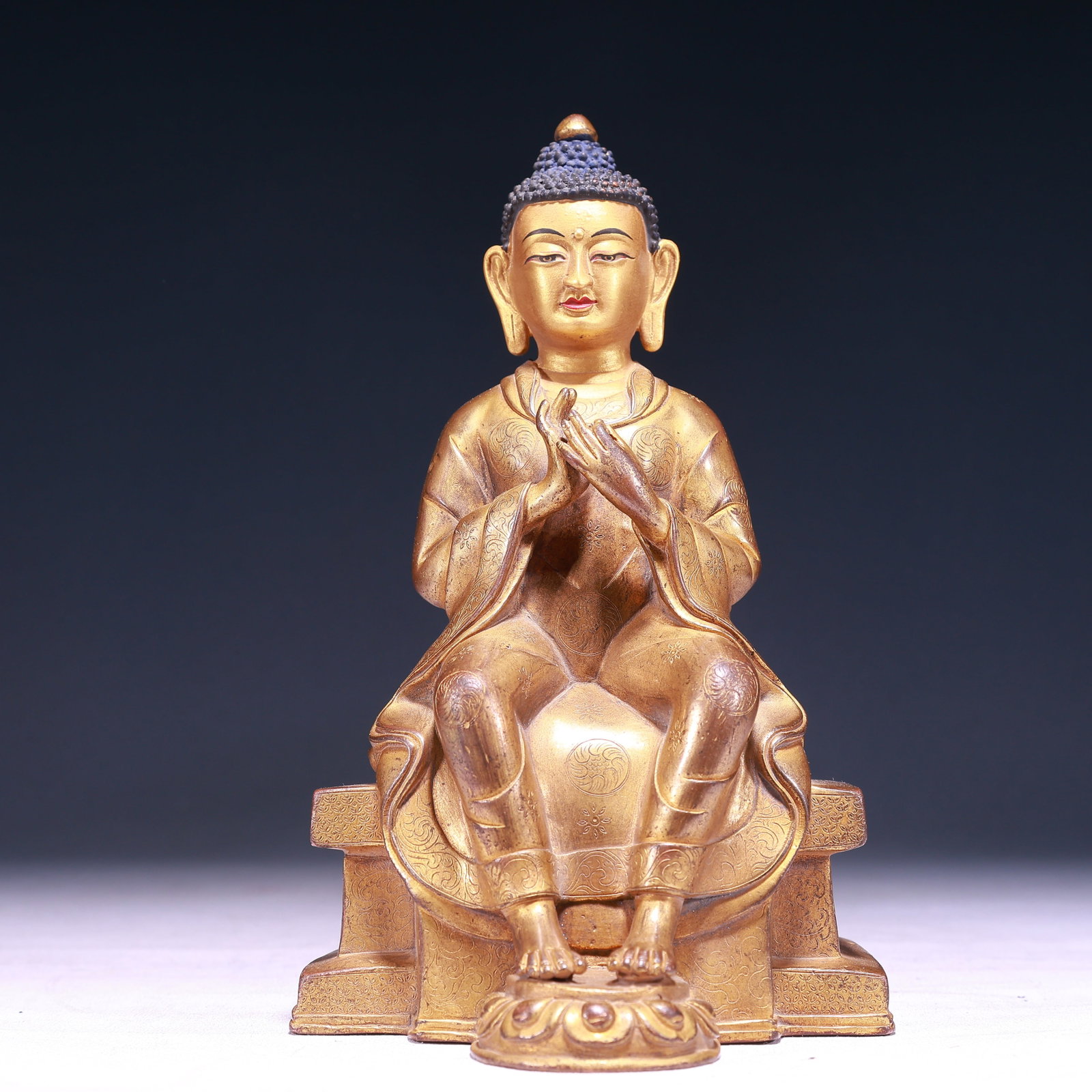 A Solemn Gilt Bronze Statue of Sakyamuni,With Inscription: A Solemn Gilt Bronze Statue of Sakyamuni,With Inscription,Qing Dynasty,China,Size:5.1inx4.7inx8.7in,Weight:2150g 铜鎏金释迦摩尼像,带铭ਧ