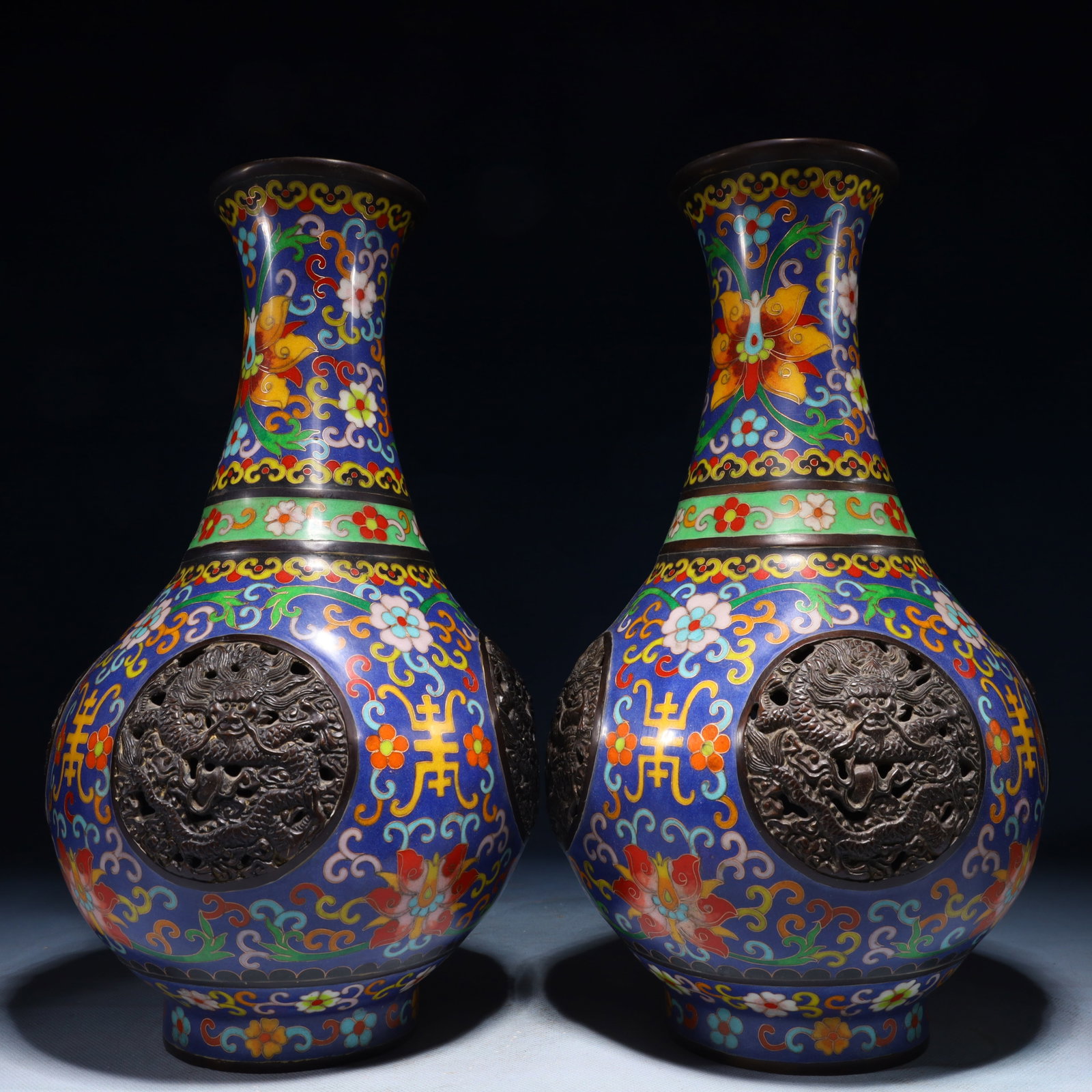 A Pair of Exquisite Cloisonne Lotus and Dragon Pattern Vases: A Pair of Exquisite Cloisonne Lotus and Dragon Pattern Vases,Qing Dynasty,China,Qianlong Four-character Mark,Size:6.7inx13.8in,Weight:6150g 一对景泰蓝缠枝!