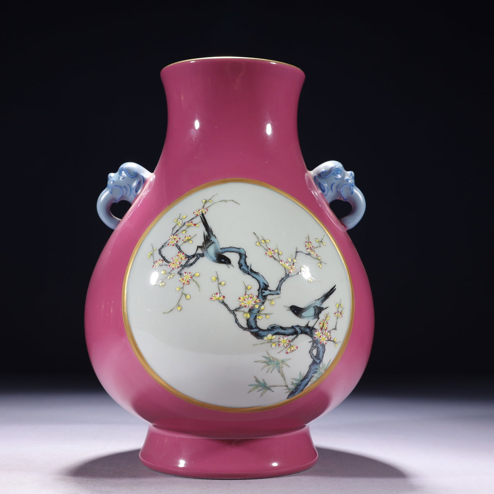 An Exquisite Ruby Red-Glazed Famille-Rose Painted Gold Flower and Bird Pattern Elephant-Ears Vase: An Exquisite Ruby Red-Glazed Famille-Rose Painted Gold Flower and Bird Pattern Elephant-Ears Vase,Qing Dynasty,China,Qianlong Six-character Mark,Size:6.7inx10.6in,Weight:1850g 胭脂红