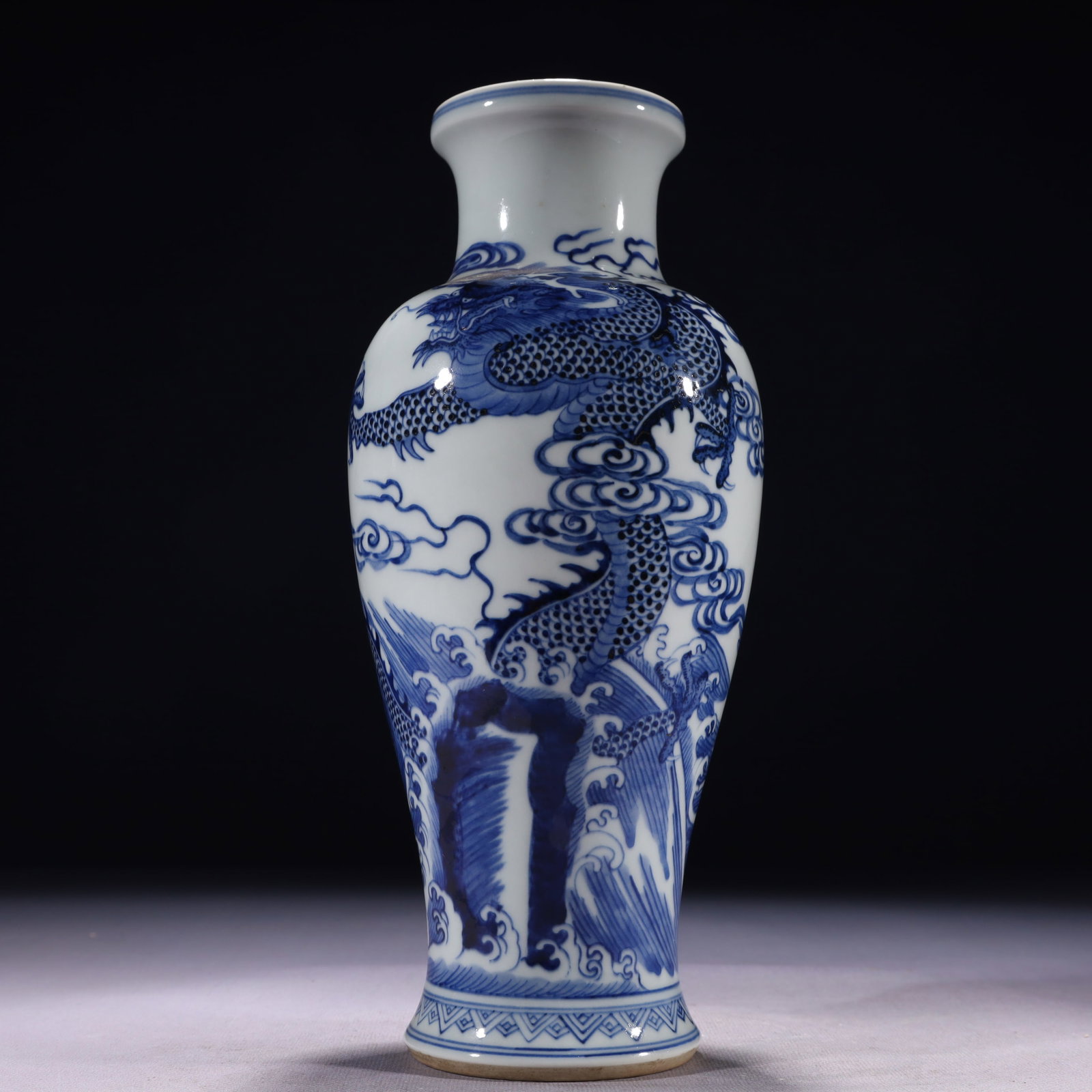 An Exquisite Blue and White Auspicious Cloud and Dragon Pattern Vase: An Exquisite Blue and White Auspicious Cloud and Dragon Pattern Vase,Qing Dynasty,China,Size:4.3inx10.6in,Weight:750g 青花祥云龙纹瓶,中国清&
