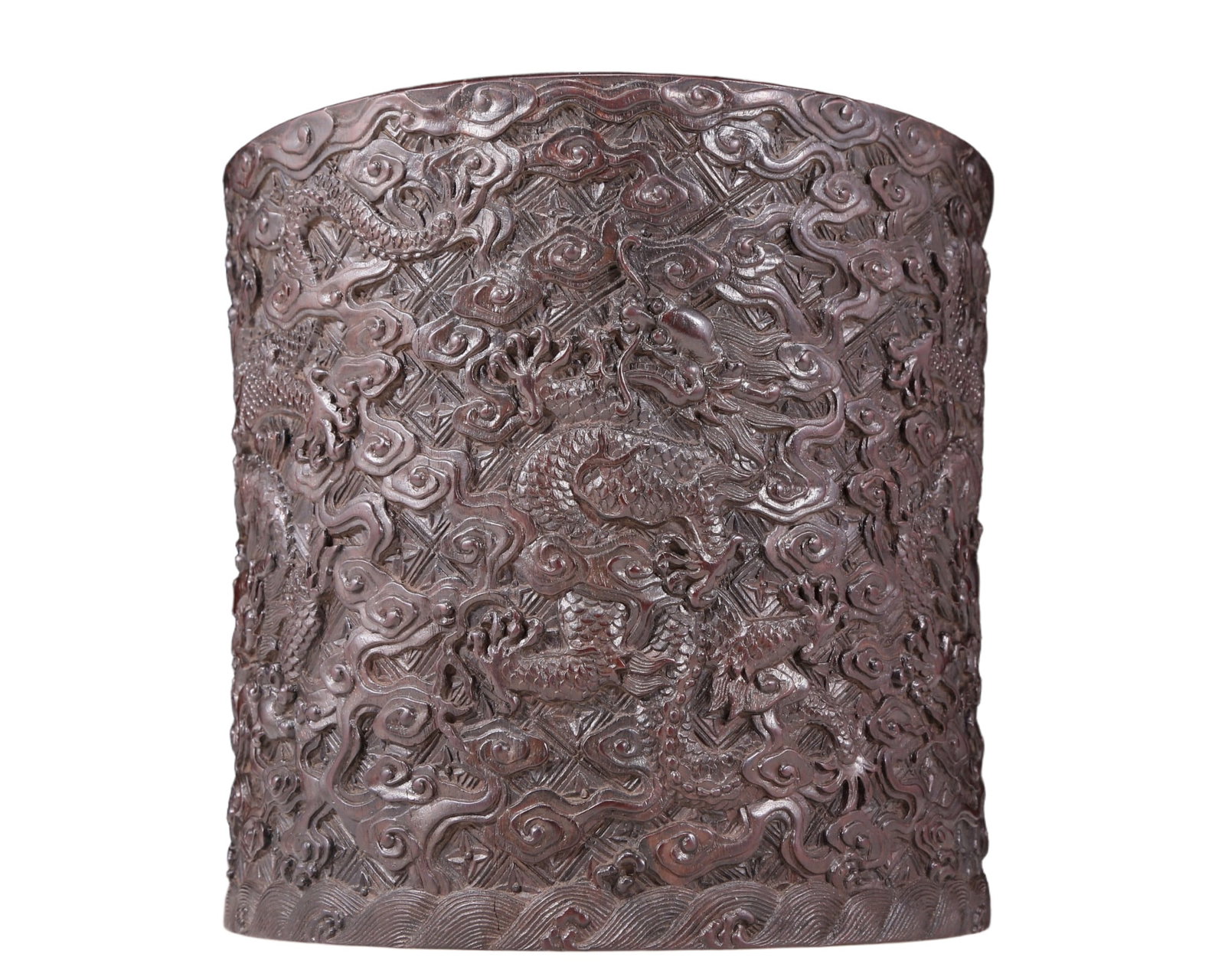 An exquisite zitanwood brush pot with cloud and dragon pattern: An exquisite zitanwood brush pot with cloud and dragon pattern, Qing Dynasty , China. using zitanwood as the base material, the overall carving is lifelike. With its excellent craftsmanship and unique